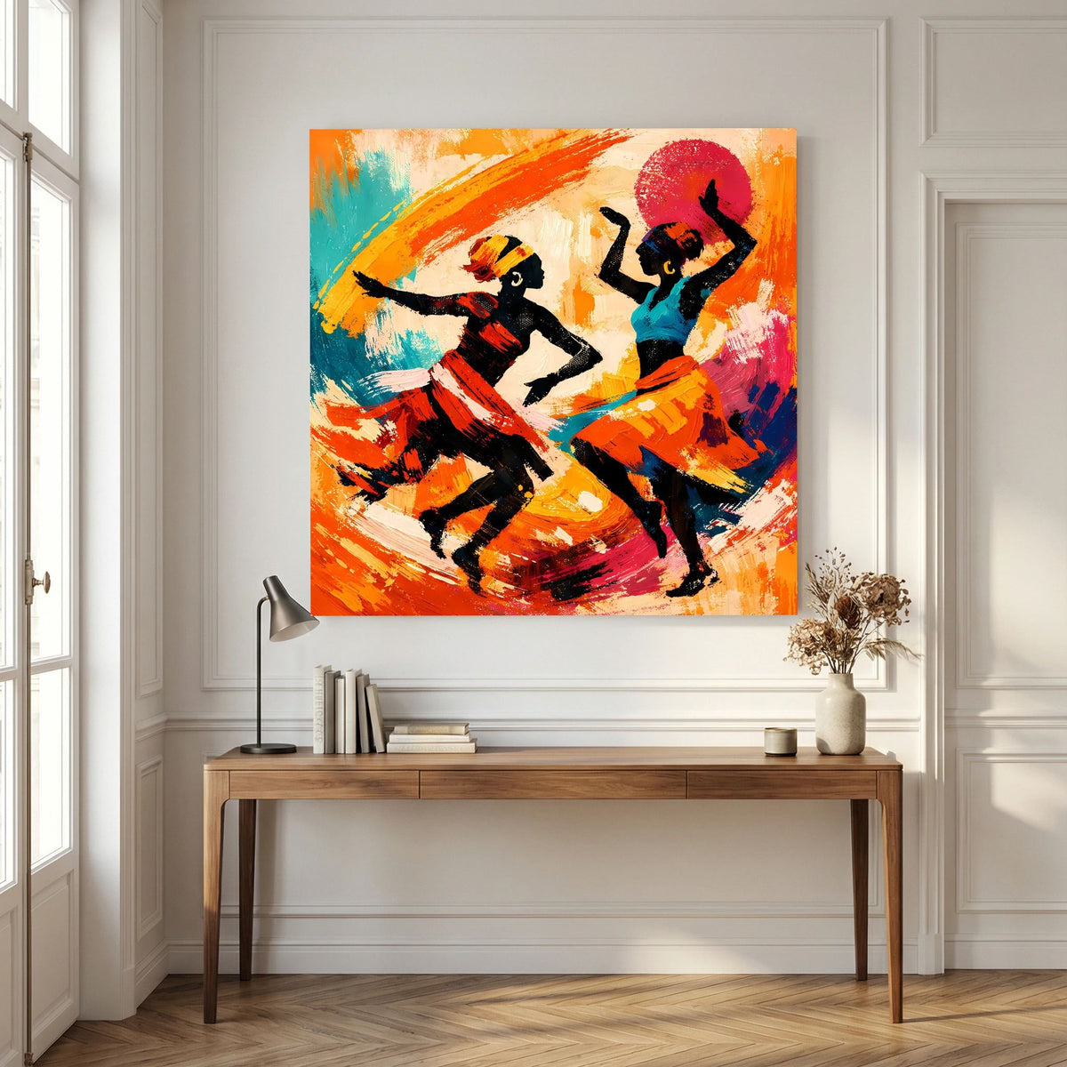 Leinwandbild mit zwei tanzenden Figuren vor roter Sonnenform, orange- und blaufarbene Spritzer