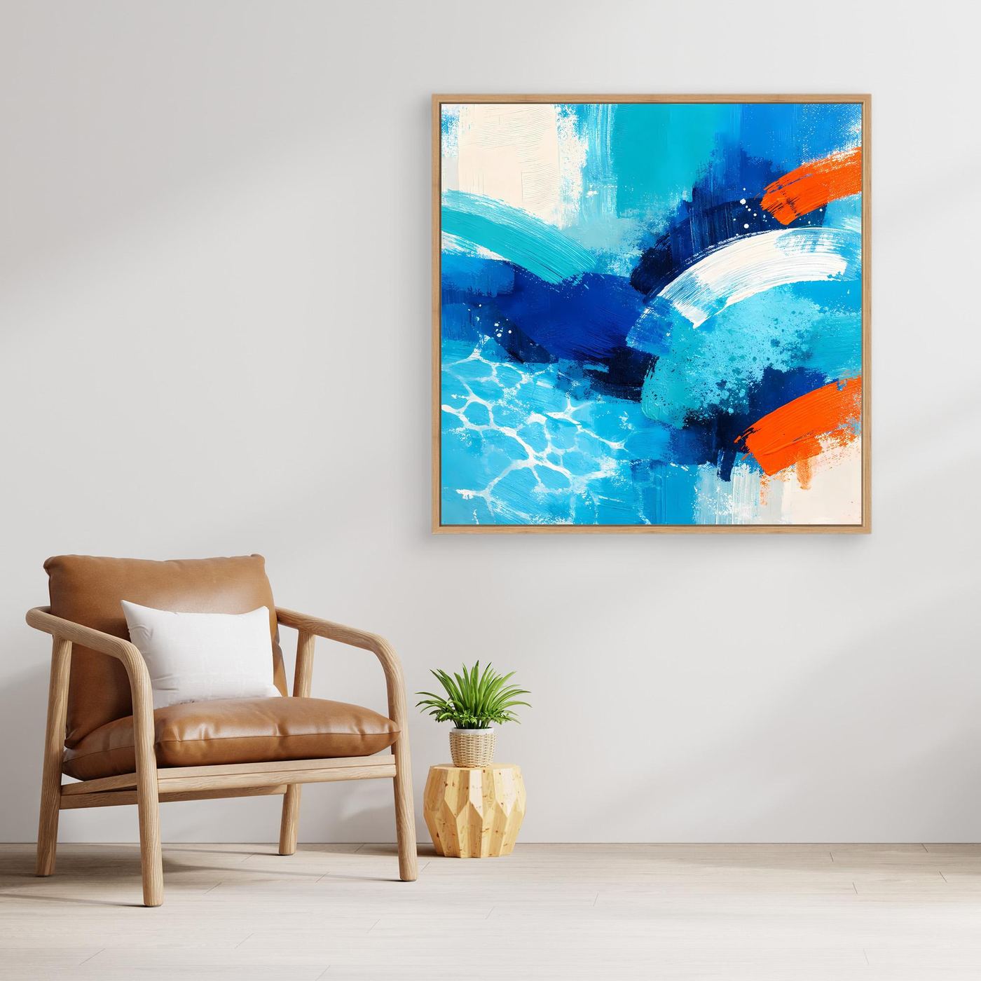 Gold-framed abstract canvas wall art of blue sea waves with orange details