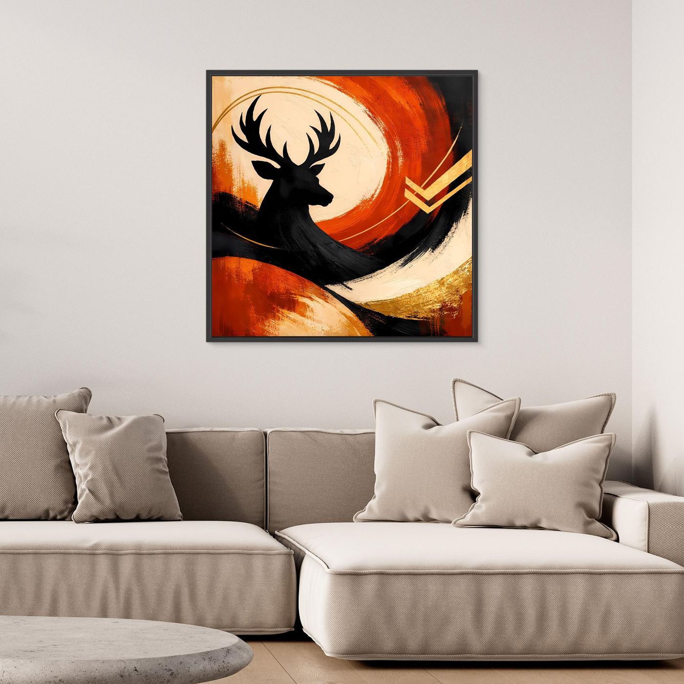 Leinwandbild mit Hirschsilhouette, orangefarbener Farbfläche, goldenen Akzenten, schwarzer Rahmen