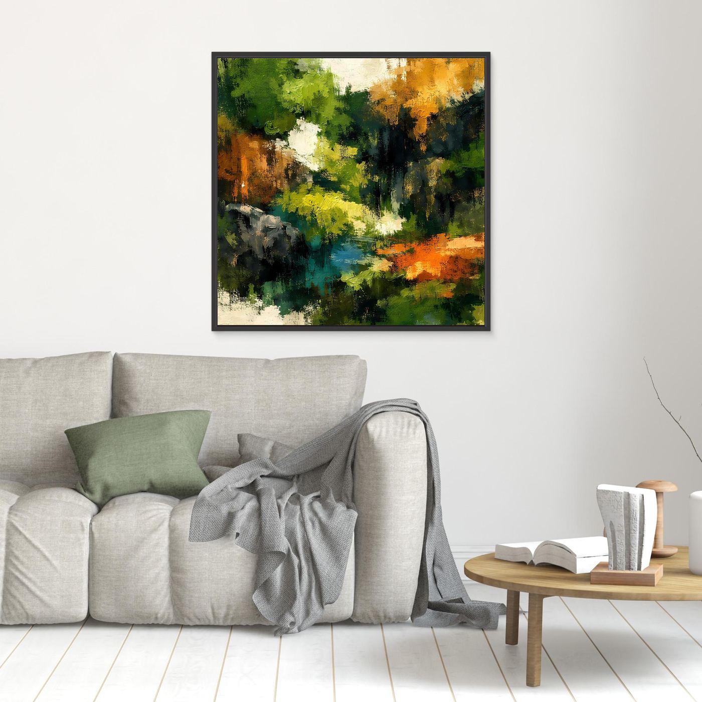 Wandbild mit abstrakter Waldlandschaft, schwarz gerahmt, im Wohnraum, grüne und orange Töne