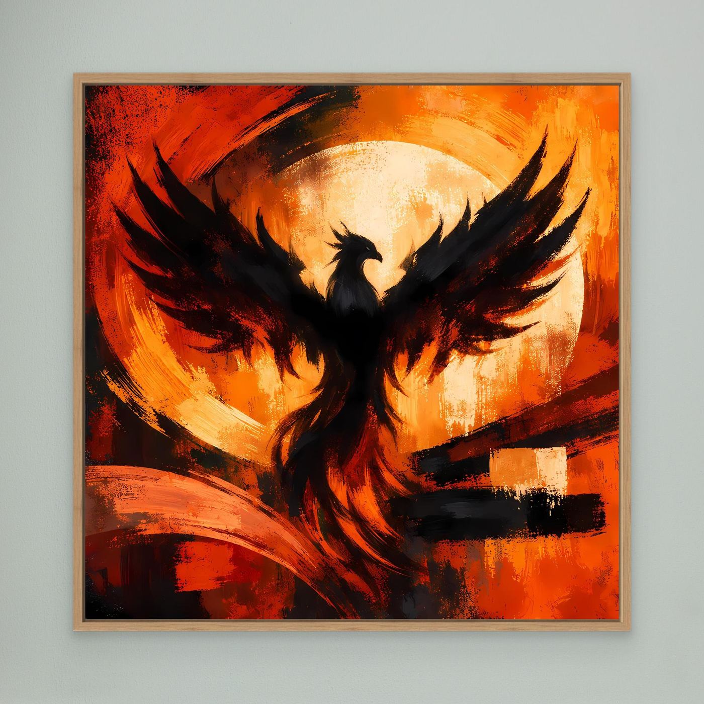 Leinwandbild mit Phönixmotiv im Holzrahmen: schwarzer Vogel vor Rot-Orange