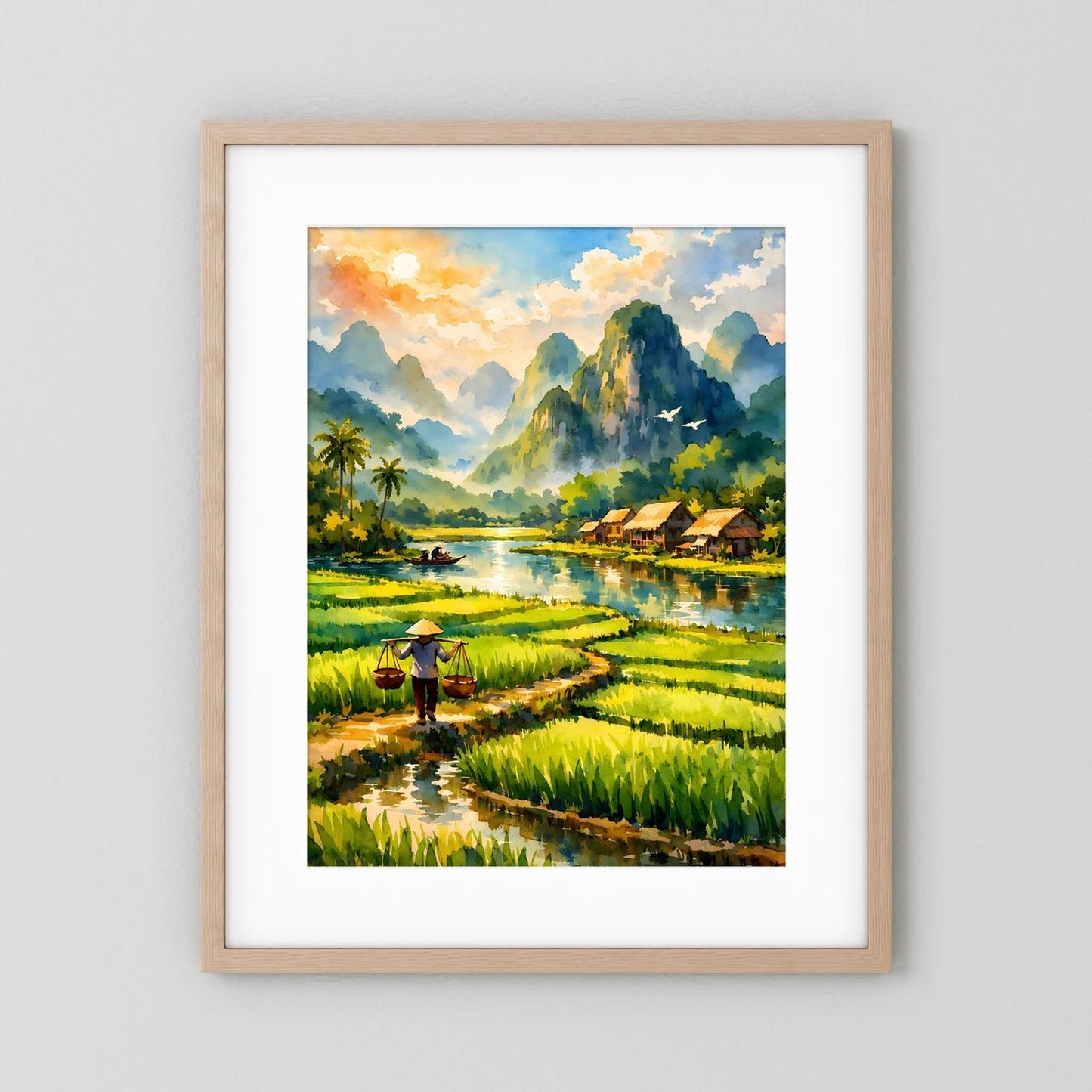 Hochformatiges Wandbild mit Reisfeldern, Fluss und Dorfhütten, Berge im Rahmen aus hellem Holz.