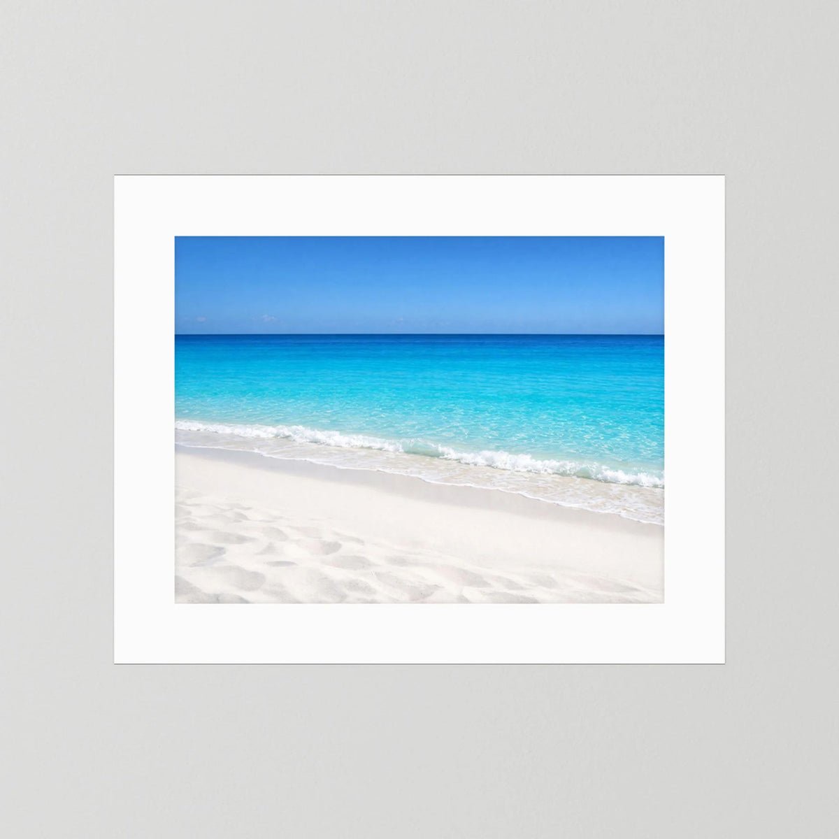 Querformat-Wandbild mit weißem Rand: türkisblaues Meer und Sandstrand