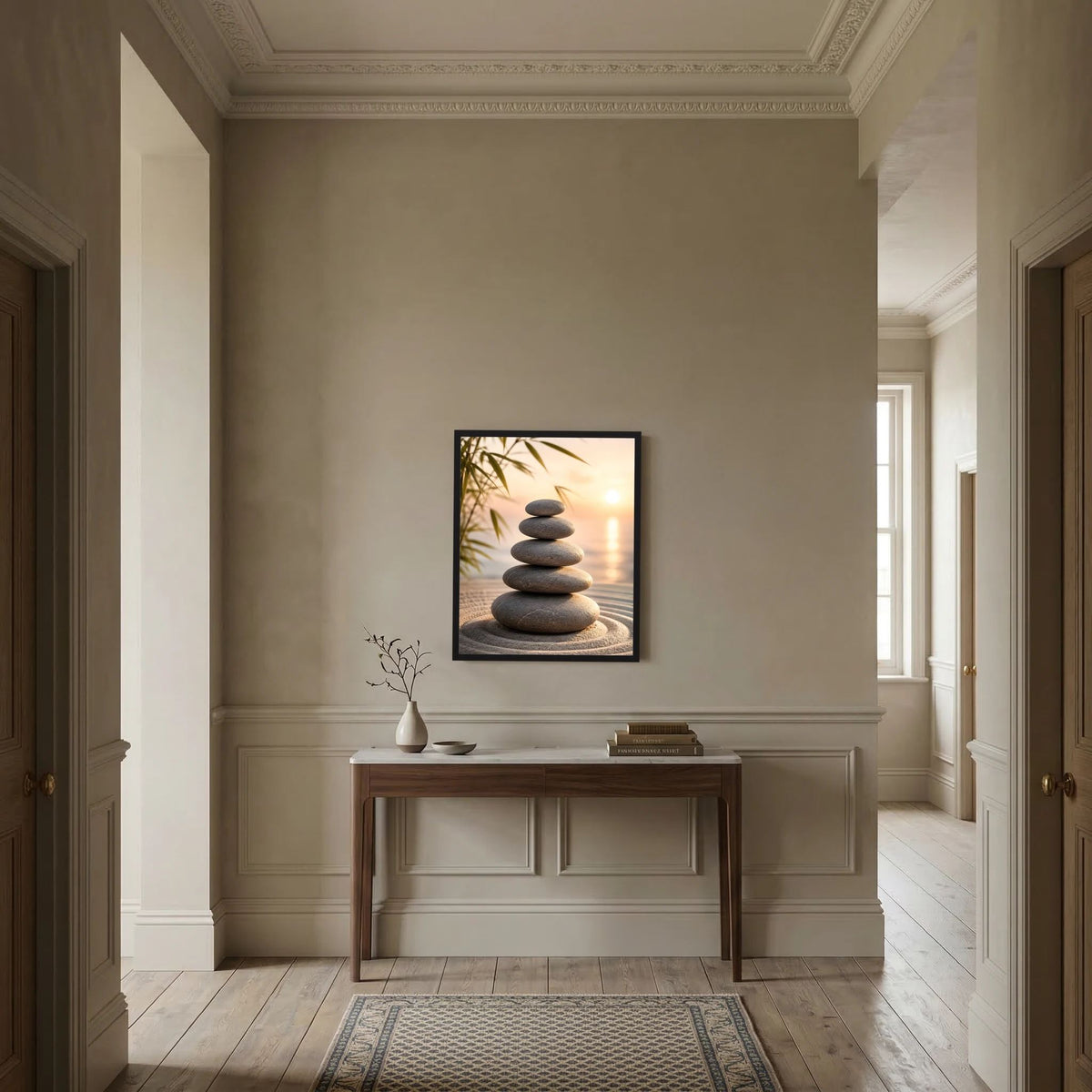 Schwarz gerahmtes Kunstposter im Hochformat mit Stapel dunkler Steine im Warmlicht