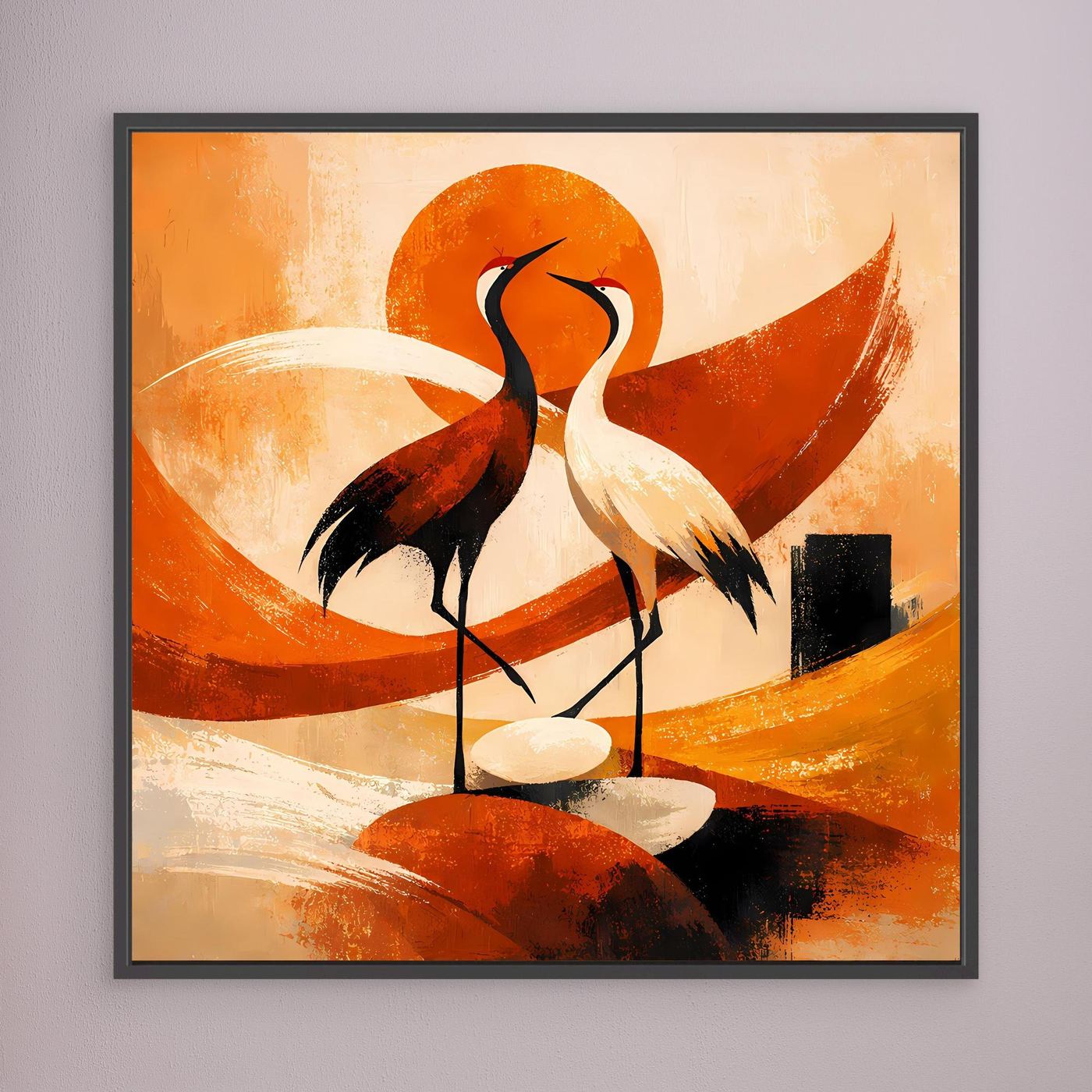 Wandbild mit zwei Kranichen im Sonnenmotiv, orangefarbene Formen, schwarz gerahmt.