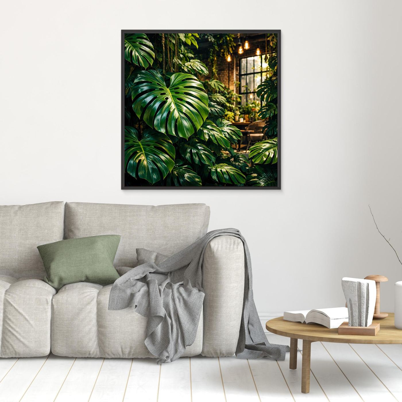Leinwandbild mit grünen Tropenblättern (Monstera), im schwarzen Rahmen