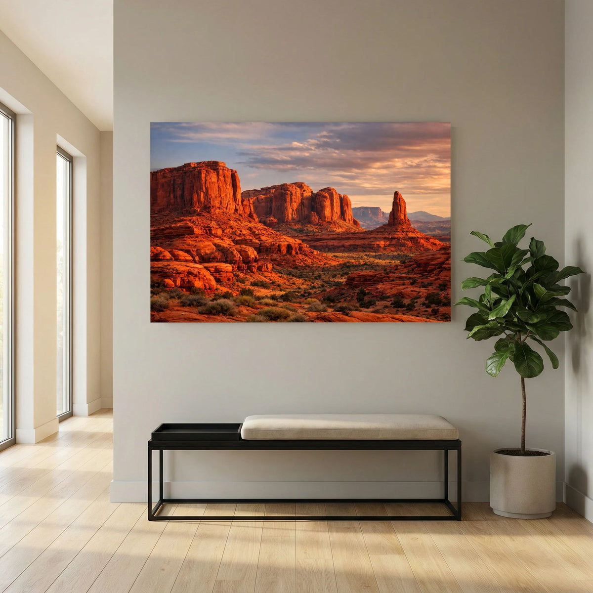 Wandbild im Querformat mit roter Felslandschaft und Abendhimmel neben Bank