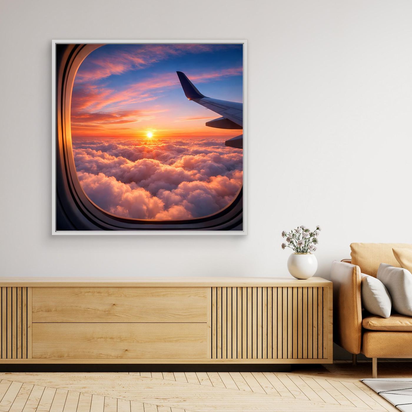 Leinwandbild: Flugzeugfenster über Wolken mit Sonnenuntergang, weißer Rahmen