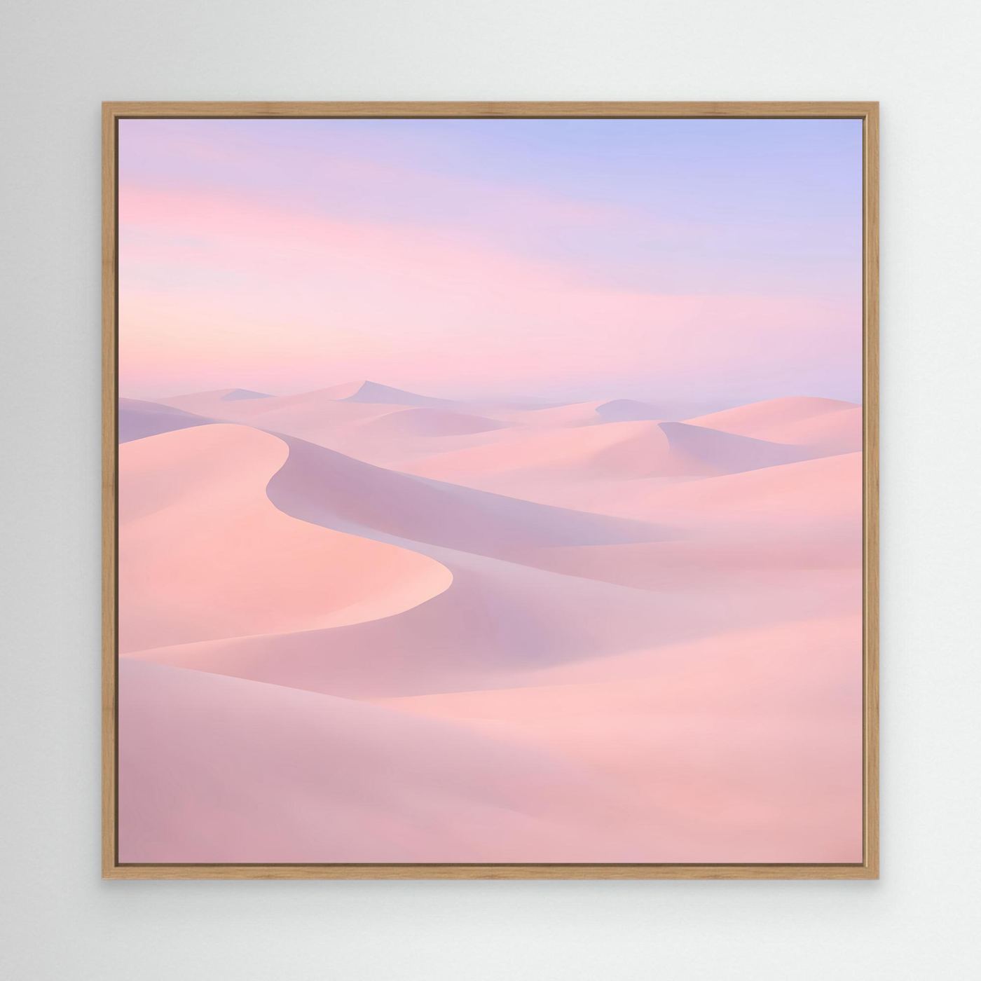 Leinwandbild mit pastellfarbenen Wüstendünen in Rosa und Violett, mit hellem Holzrahmen