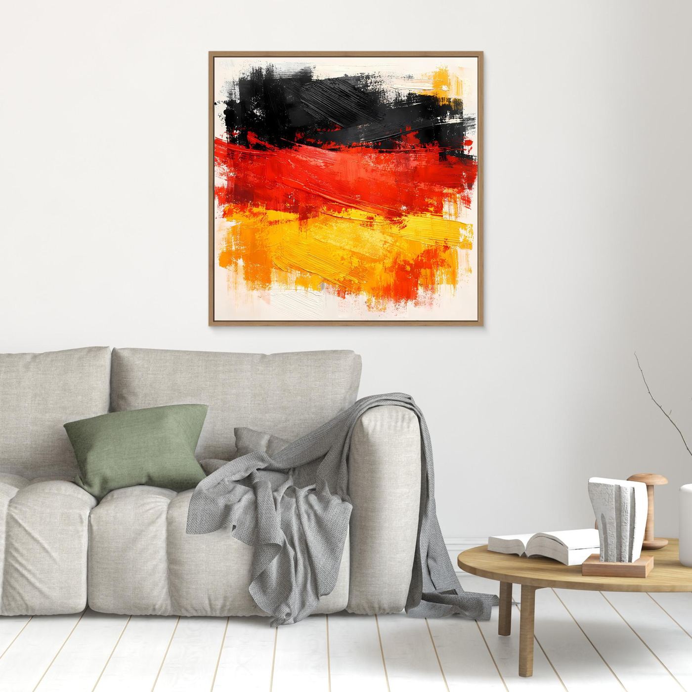 Framed abstract canvas wall art with black, red, and yellow brushstrokes in a tan frame