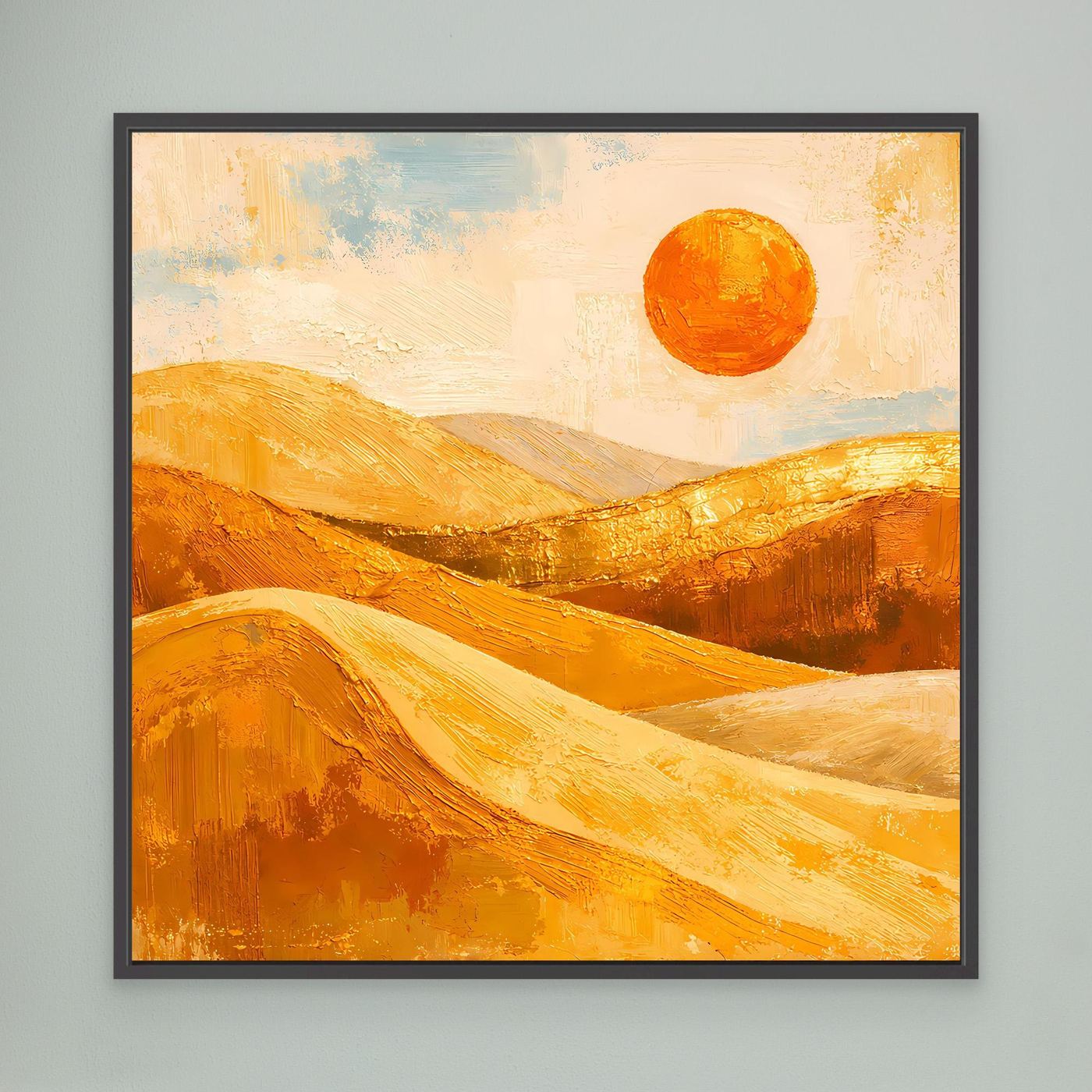 Wandbild mit abstrakten goldenen Dünen und orangefarbener Sonne, schwarz gerahmt