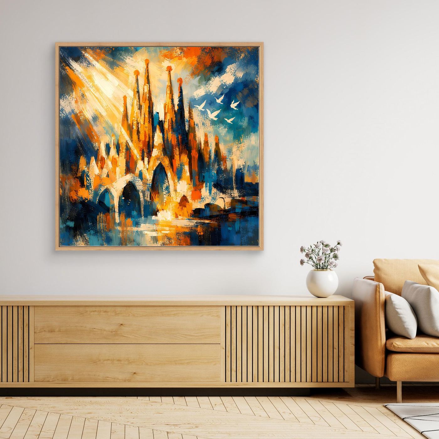 Abstraktes Leinwandbild mit hellem Holzrahmen, Architekturmotiv mit Türmen in Blau-Orange und Gelb.