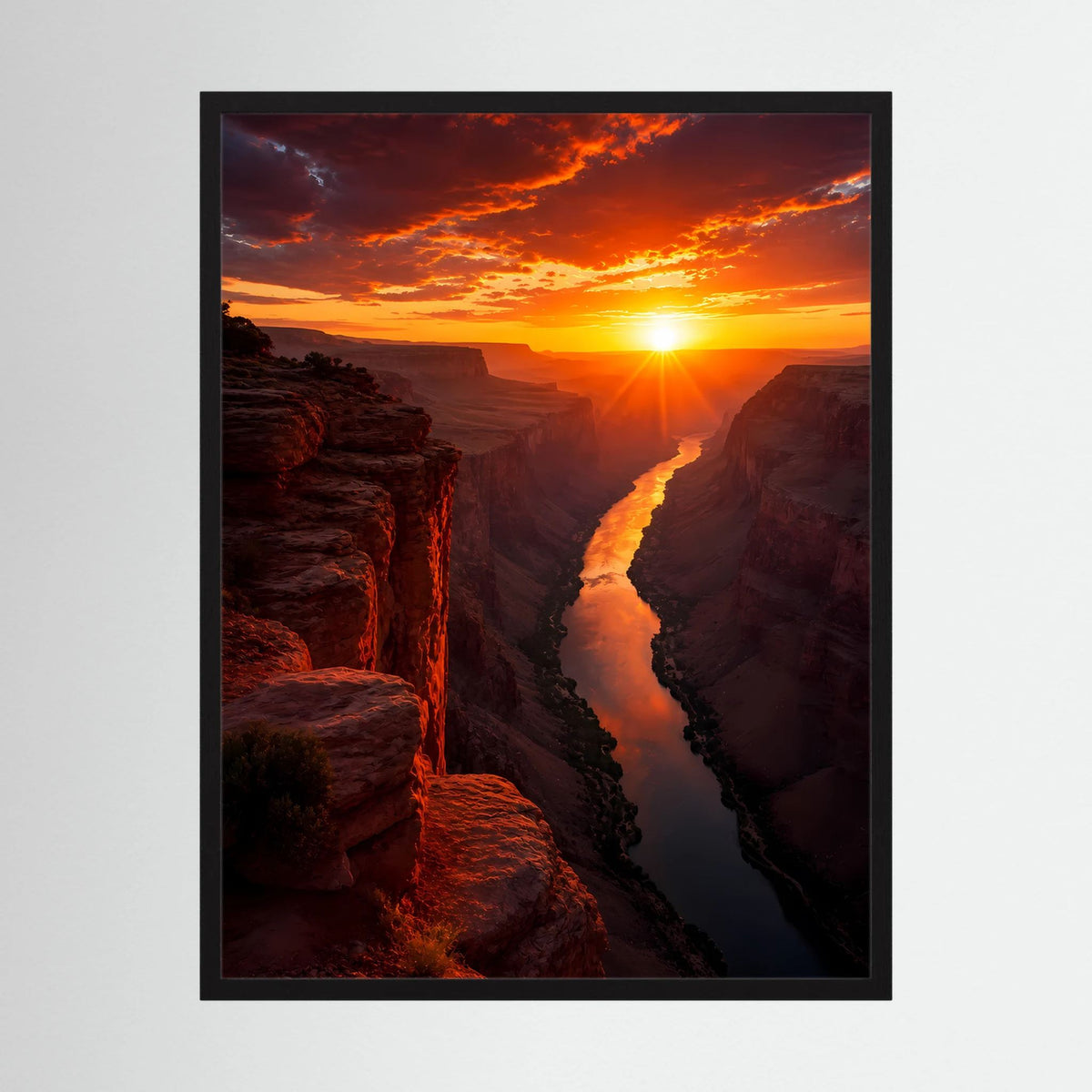 Hochformat-Poster mit Sonnenuntergang und leuchtendem Fluss zwischen Felsen, schwarzer Rahmen