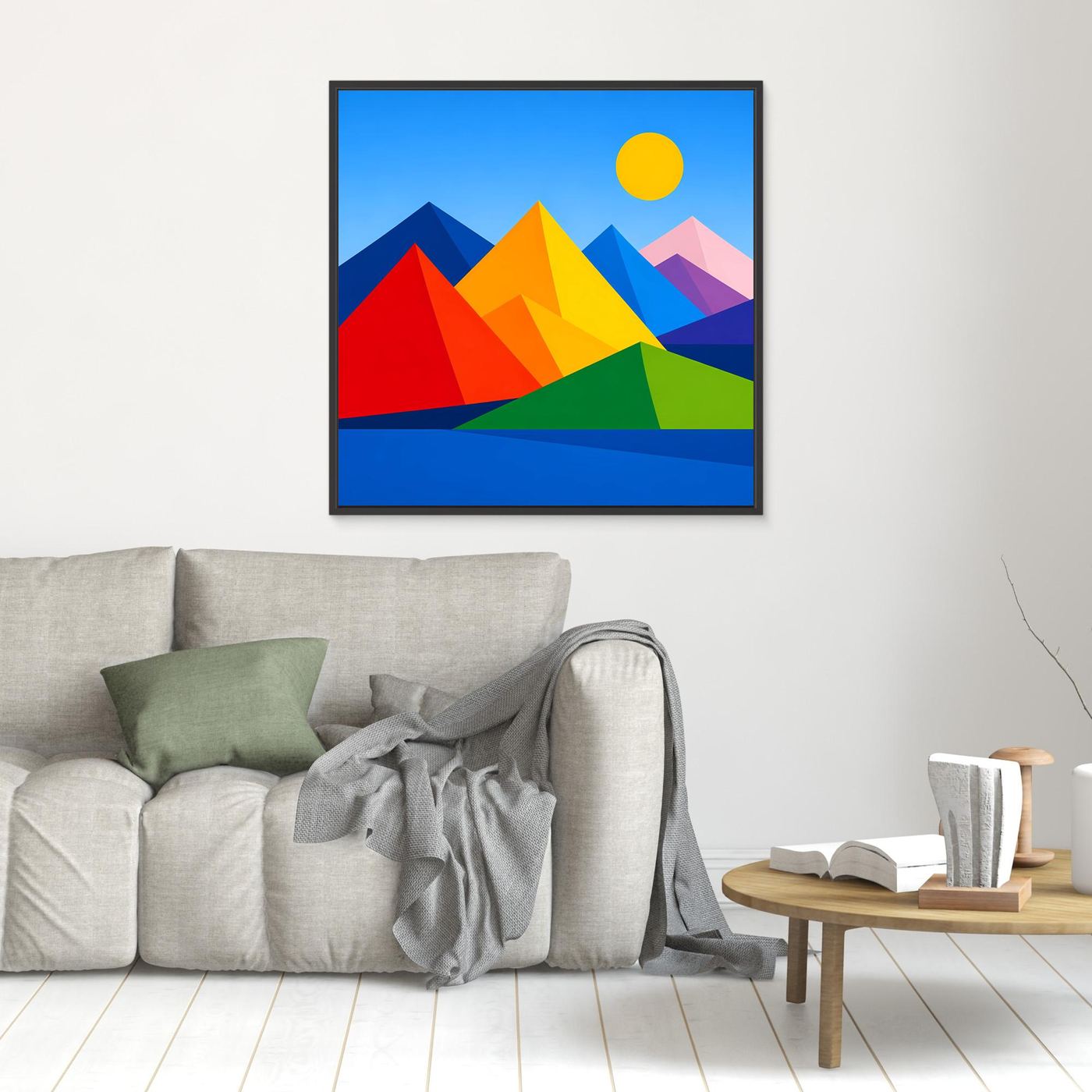 Gerahmtes Leinwandbild mit geometrischer Berglandschaft und Sonne, farbige Dreiecke.