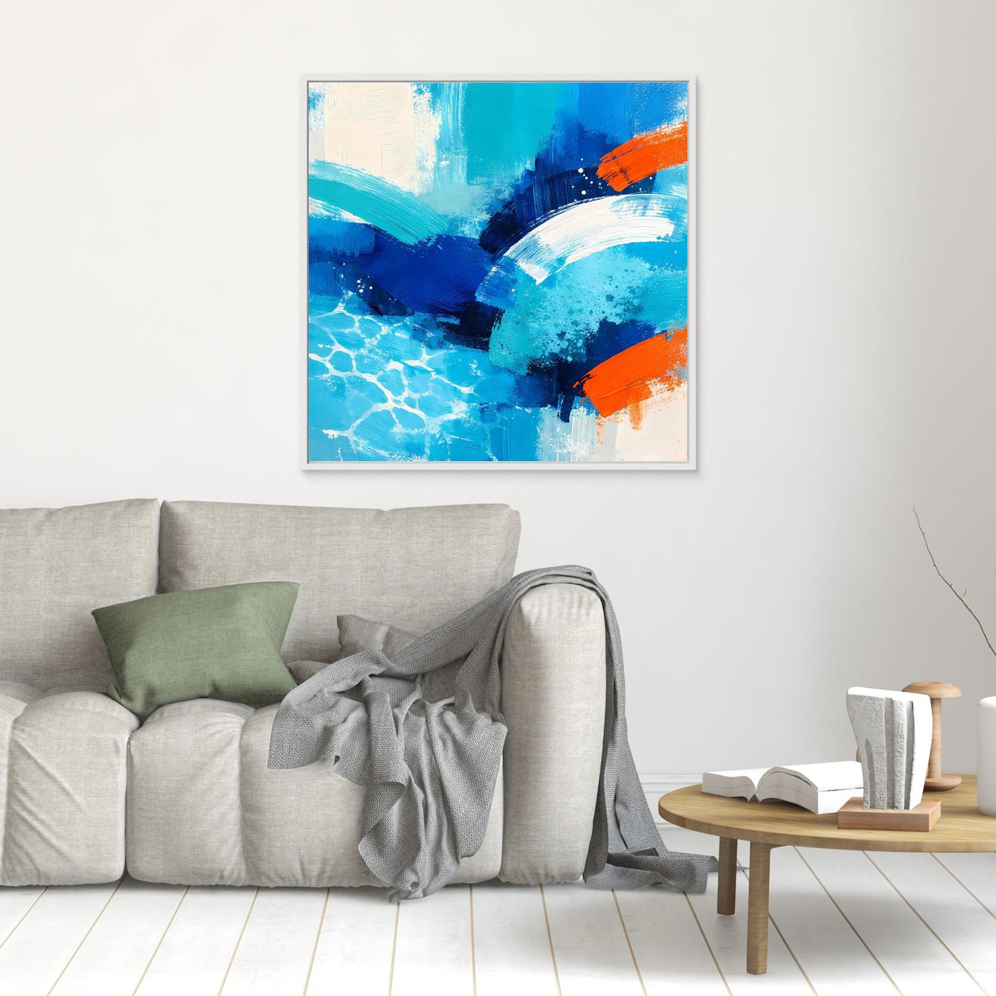 Blue and orange abstract ocean wave canvas in a white frame.