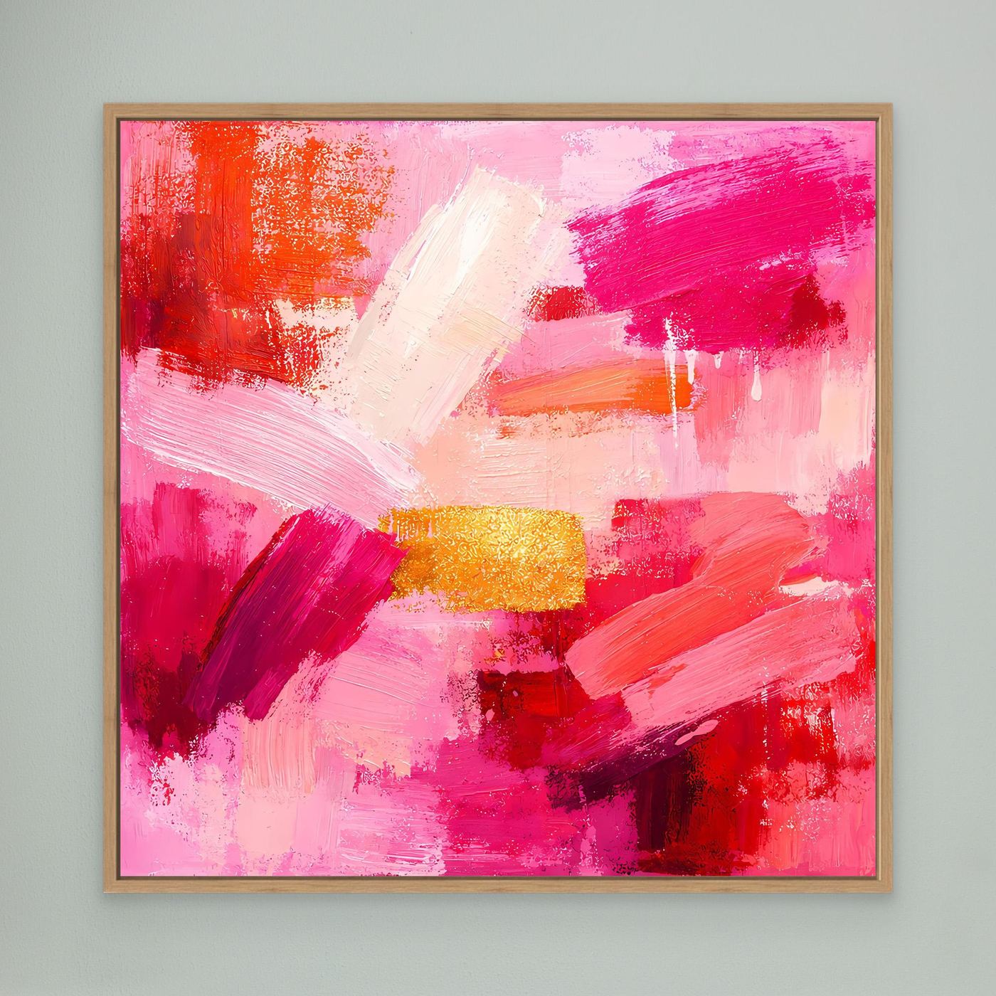 Abstract canvas wall art in pink and orange with gold accent, in an oak frame.