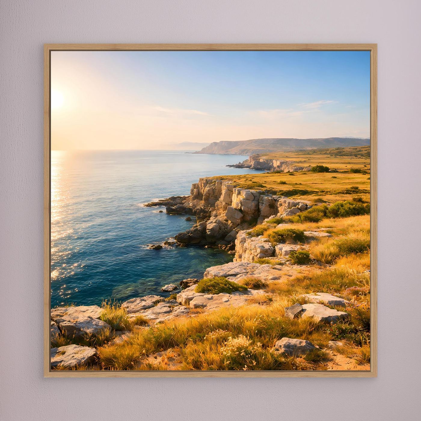 Leinwandbild Steilküste: Meer, Felsen und gelbes Gras bei Sonnenlicht, Eichenrahmen