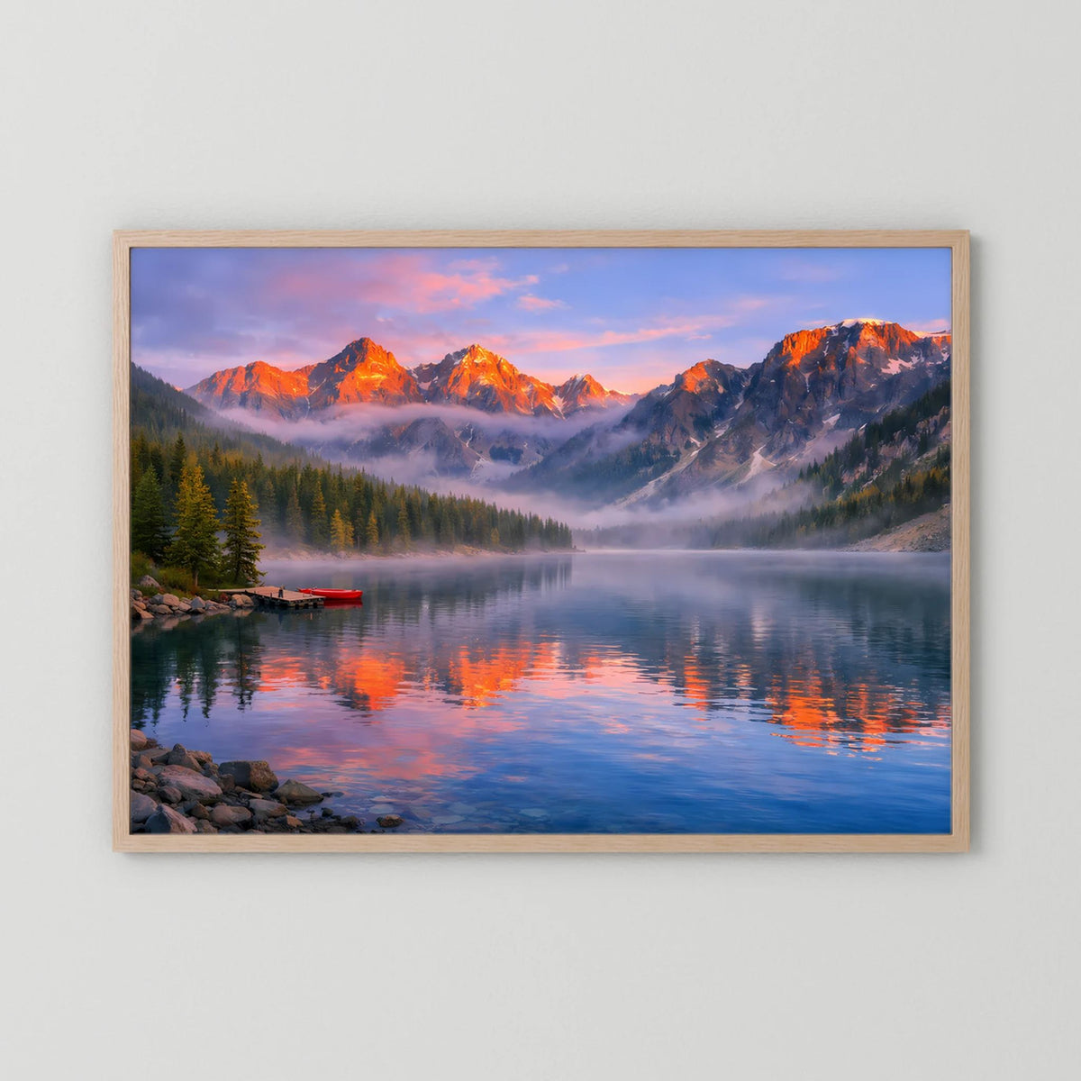 Querformatiges Wandbild mit Alpen-See-Landschaft bei Sonnenuntergang im hellen Holzrahmen