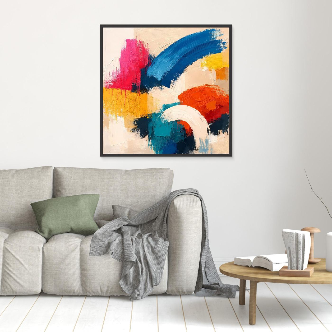 Small abstract canvas painting with blue, pink, red, yellow, and white brushstrokes; black frame.