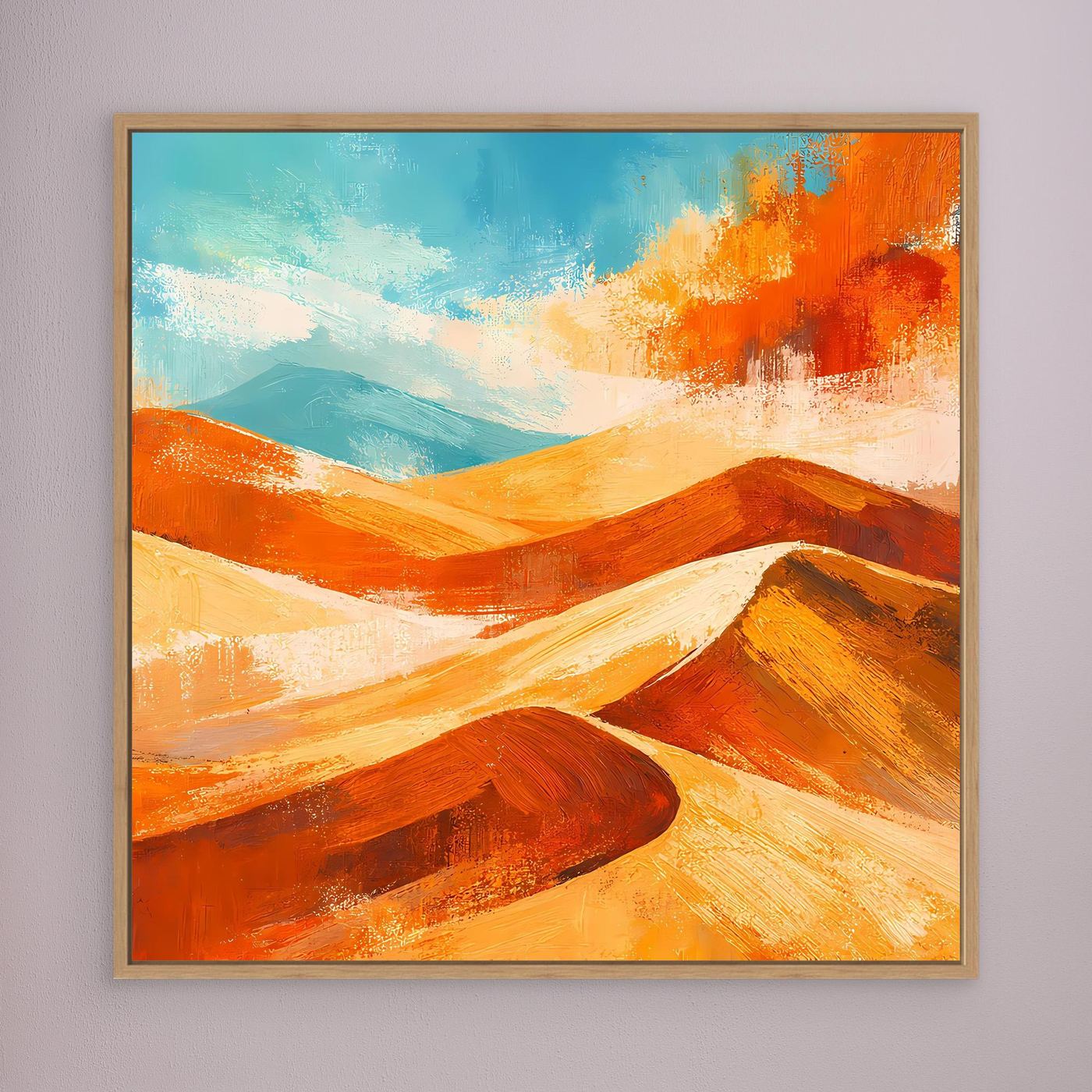 Abstract desert wall art with orange and gold dunes and blue sky; oak frame