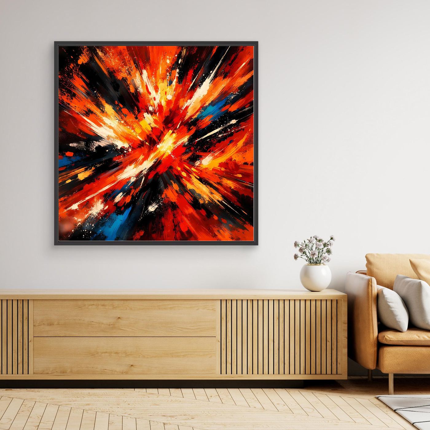 Abstraktes Leinwandbild mit Farbexplosion in Rot, Orange, Gelb und Blau; schwarzer Rahmen