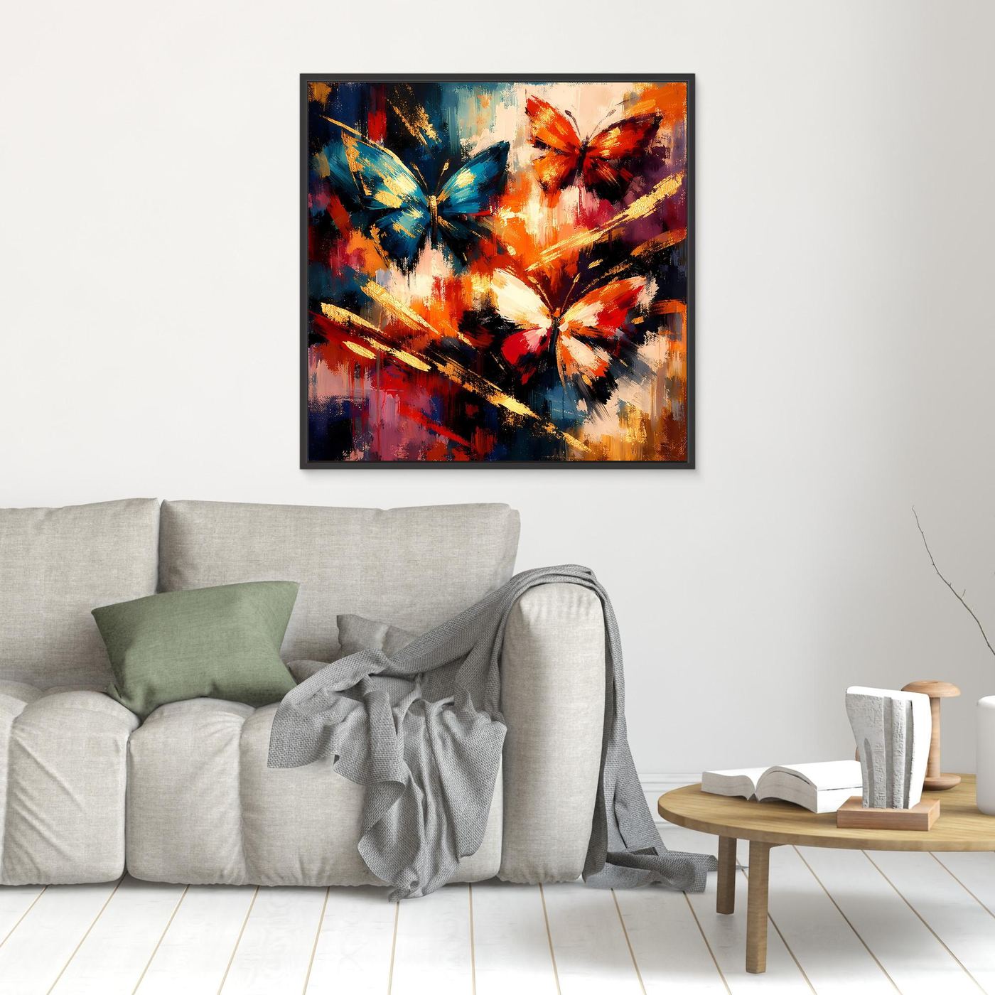 Wandbild mit abstrakten Schmetterlingen in Blau, Orange und Rot, schwarzer Rahmen.