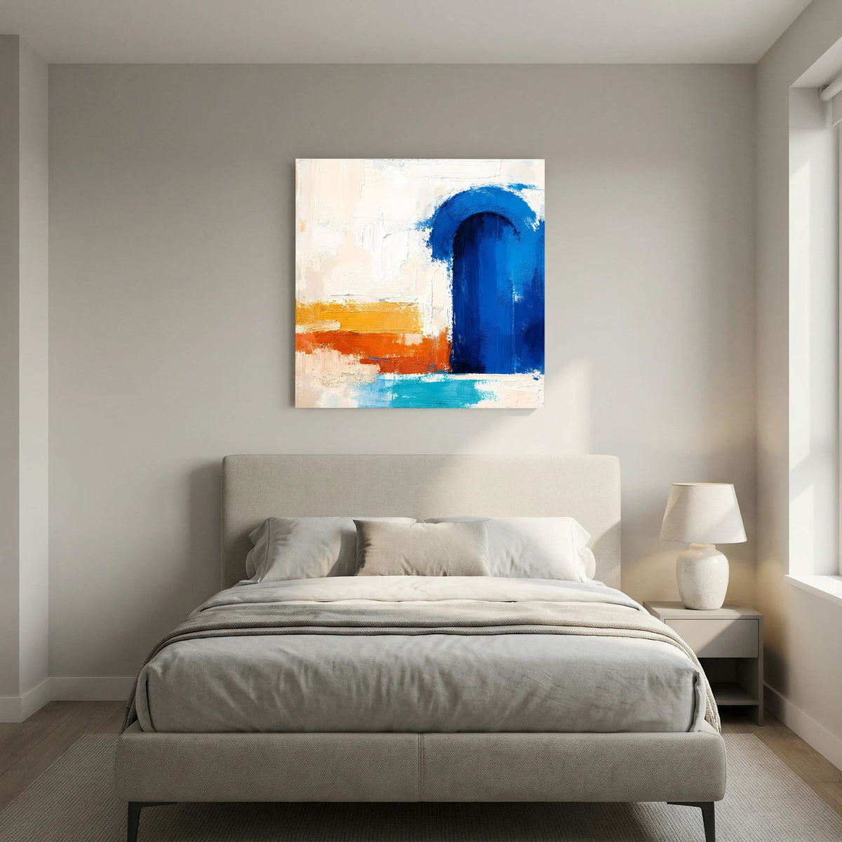 Weiß gerahmtes Leinwandbild mit blauem Torbogen und abstraktem Orange-Blau-Muster