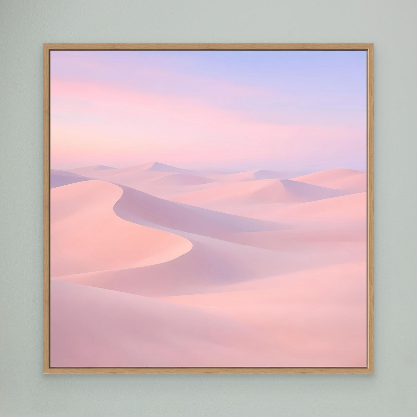 Leinwandbild mit pastellfarbenen Wüstendünen in Rosa und Violett, mit hellem Holzrahmen