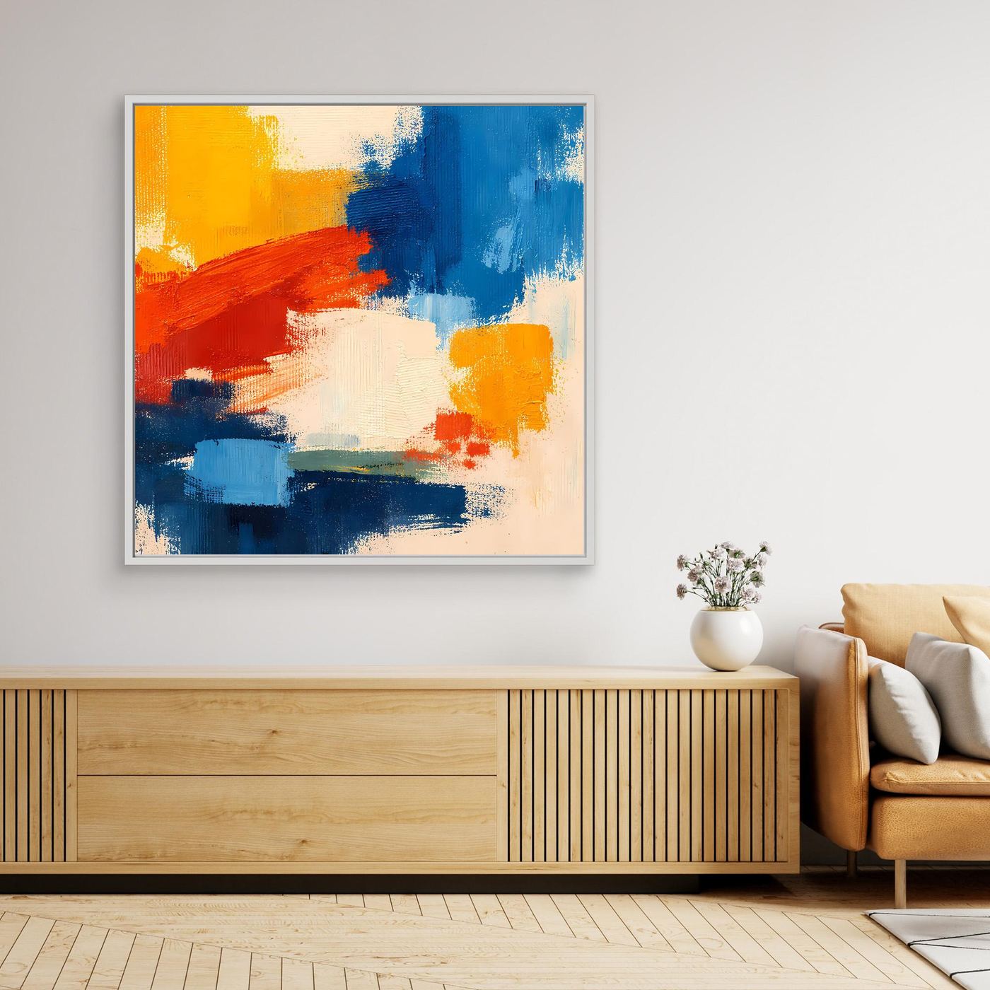 Abstract canvas wall art with pale frame and blue, yellow, and red brush textures