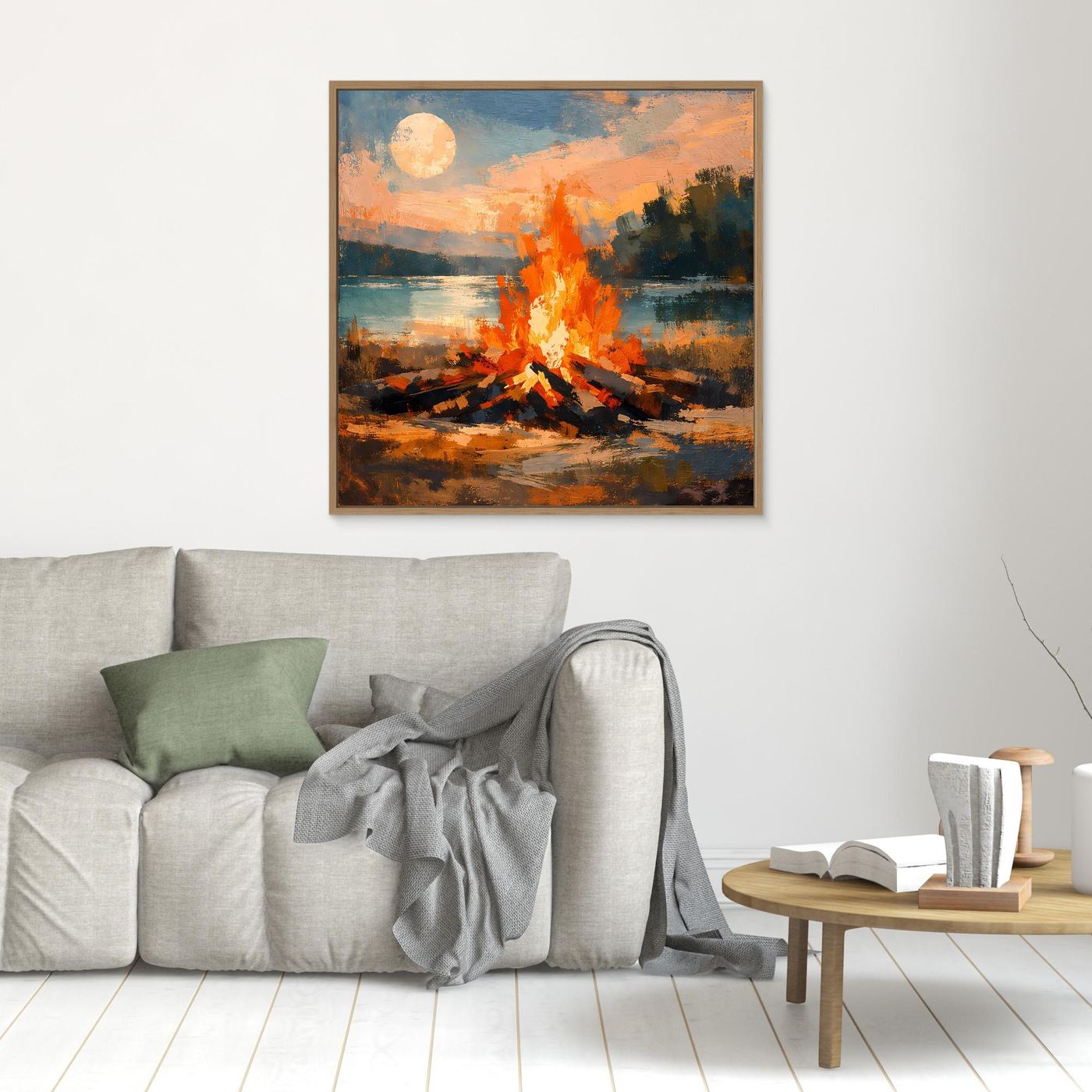 Quadratisches Wandbild mit Lagerfeuer am See, orange Flammen und runder Sonne; brauner Rahmen