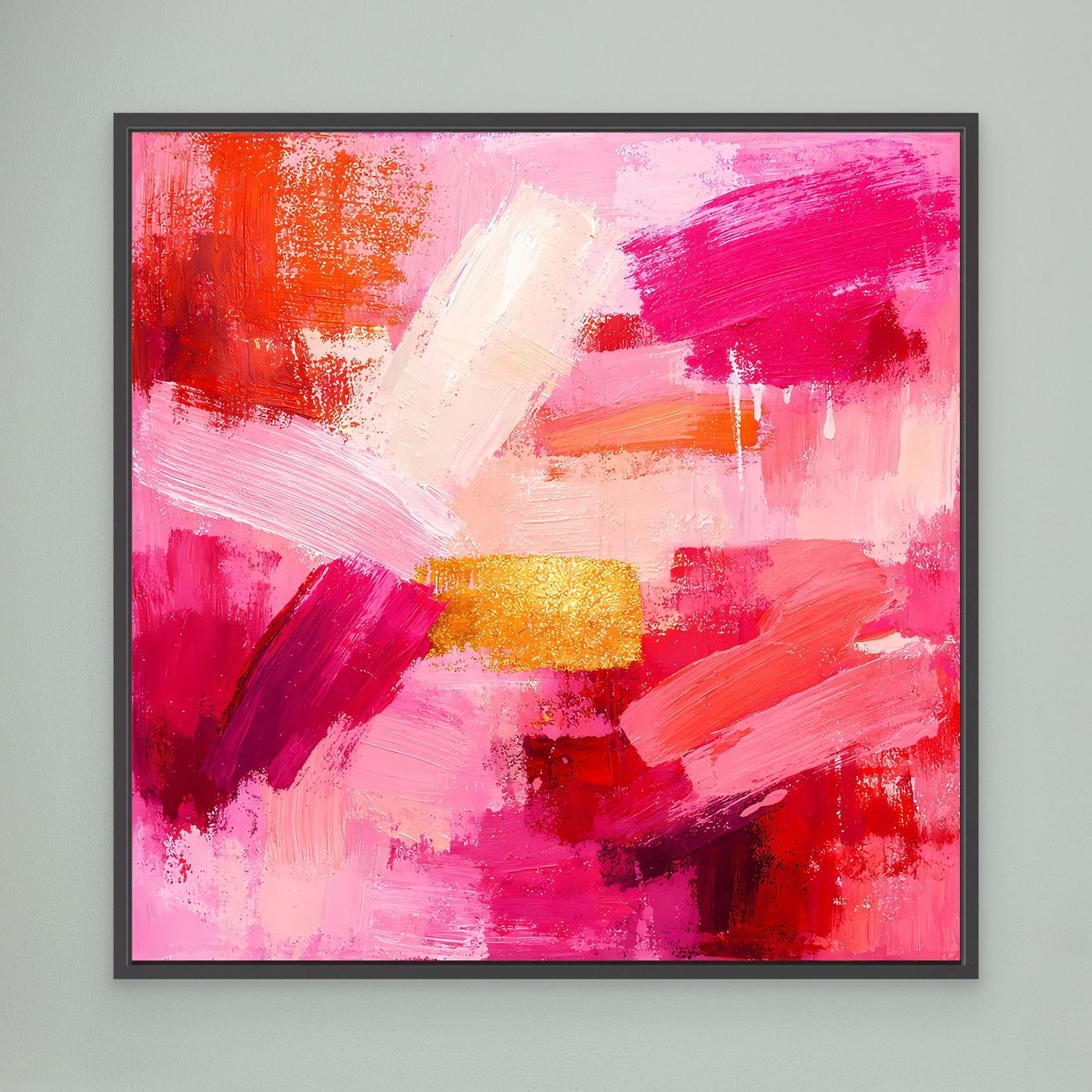 Black-framed abstract canvas wall art with pink and red brushstrokes plus gold accent block