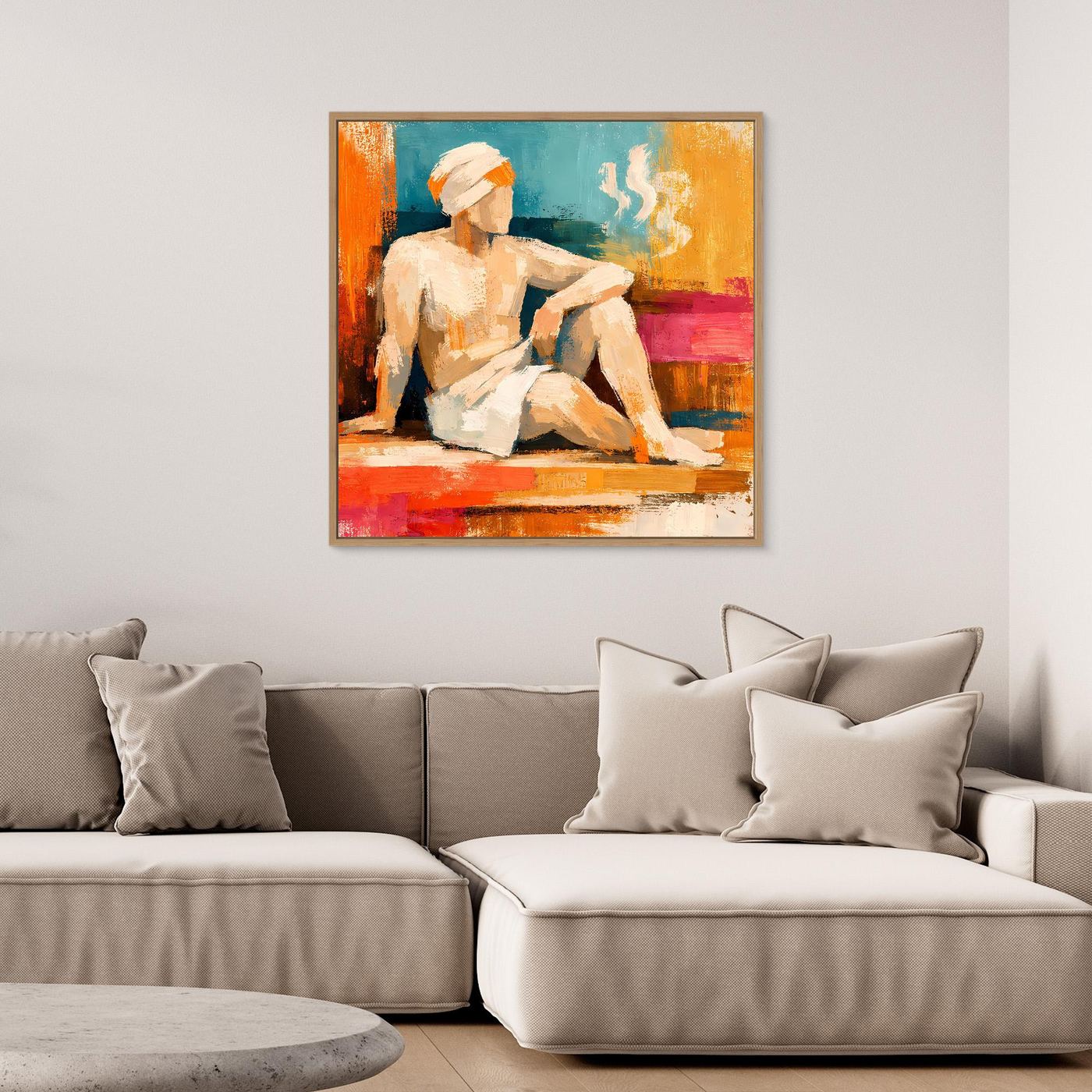 Abstract canvas wall art with seated figure in orange, teal, and pink; light wood frame