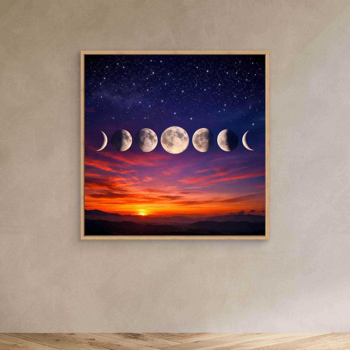 Leinwandbild mit Sternenhimmel und Mondphasen in hellem Holzrahmen an der Wand