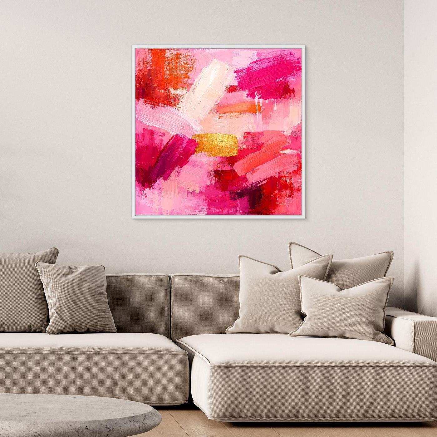 Abstract canvas wall art with pink and rose brushstrokes and small gold accents.