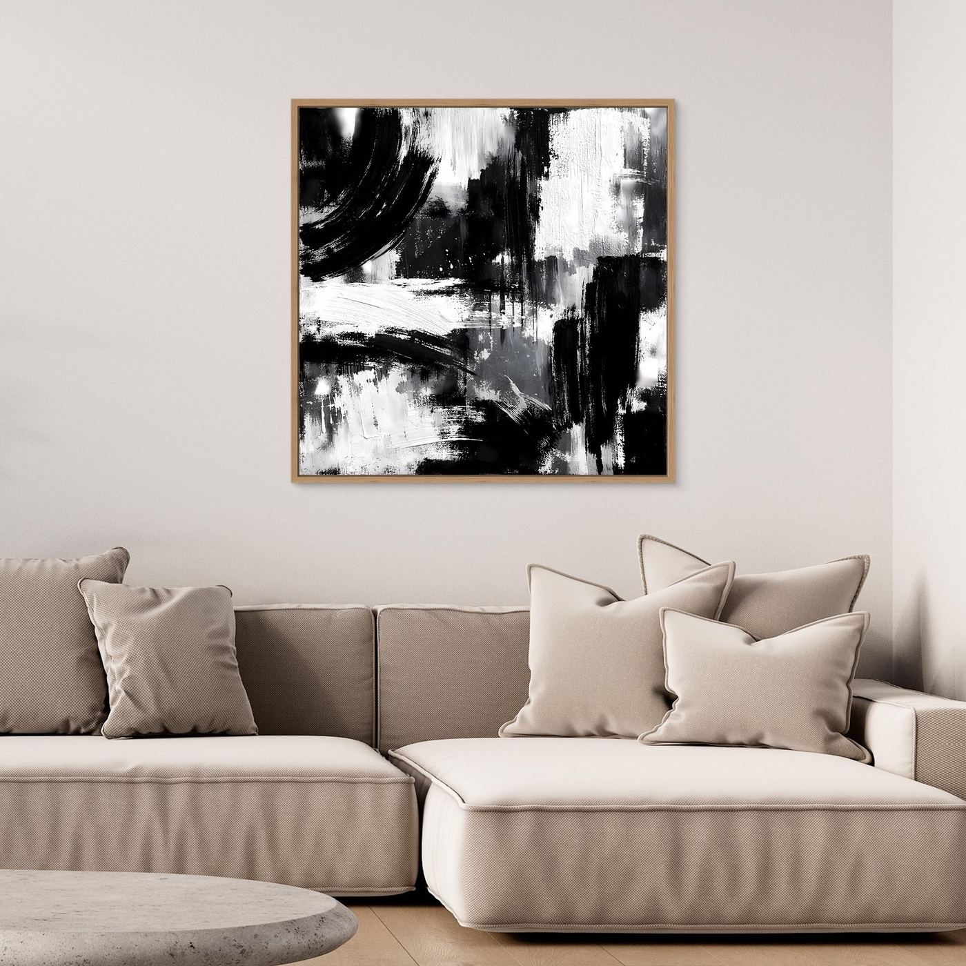 Square black-and-white abstract canvas painting in light wood frame