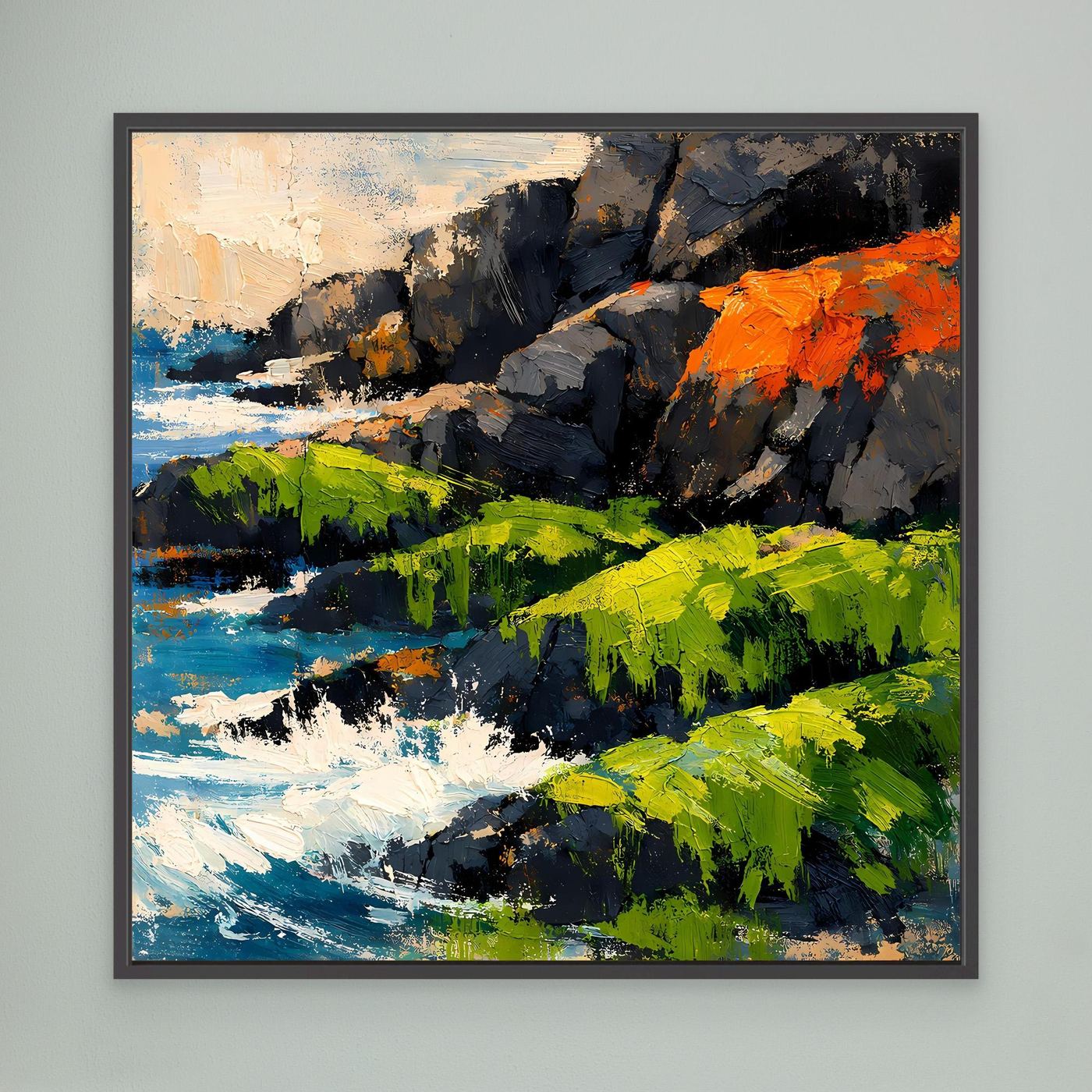 Abstraktes Leinwandbild mit Küstenfelsen, blauem Wasser und grünen Flächen im schwarzen Rahmen