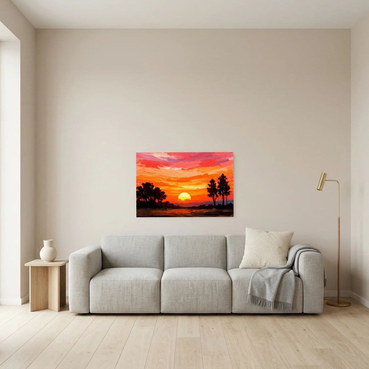 Acryl-Kunstwerk im Querformat über grauem Sofa: orange-roter Sonnenuntergang mit Bäumen