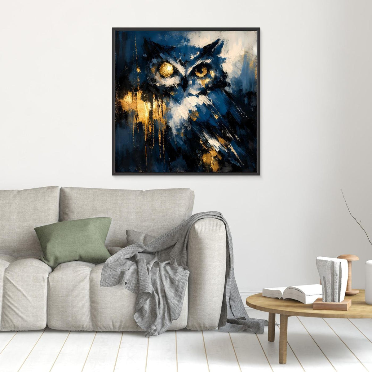 Abstraktes Eulen-Leinwandbild mit leuchtenden Augen in Blau und Gold, schwarzer Rahmen