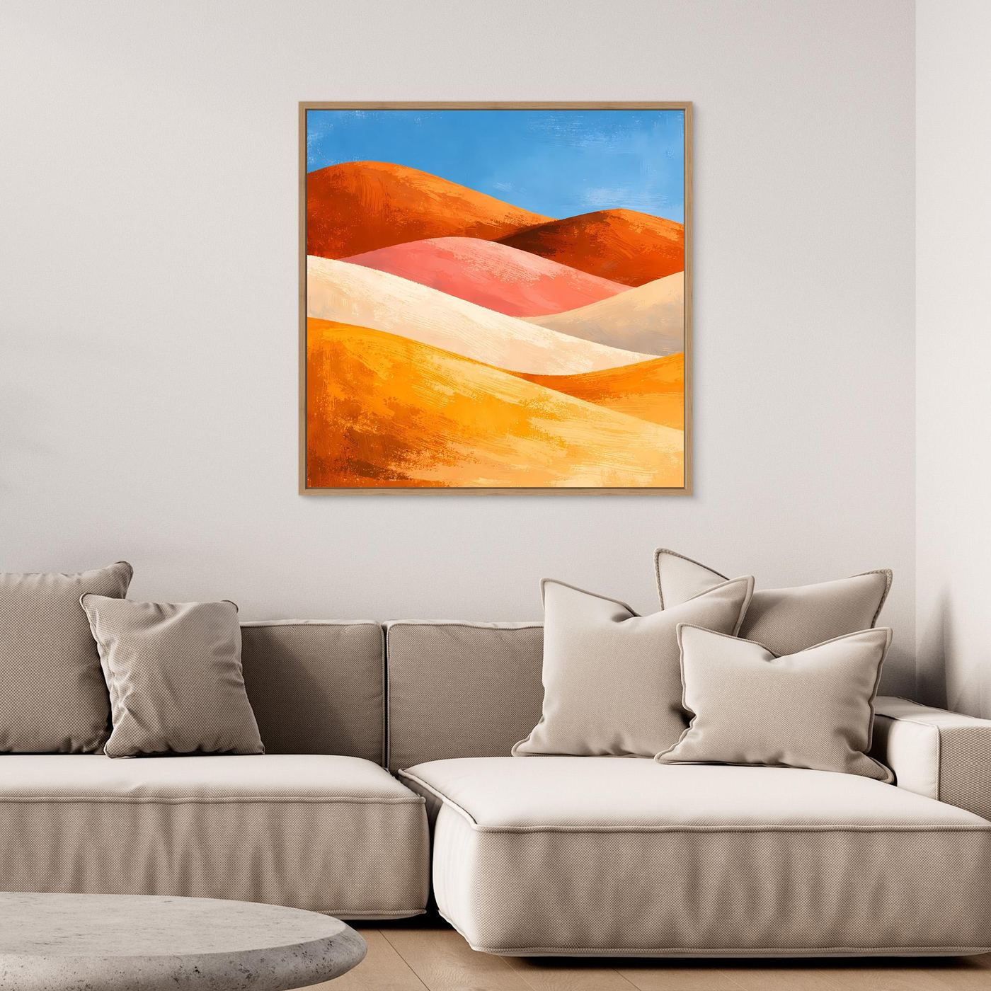 Gerahmtes Leinwandbild: abstrakte Dünenlandschaft in Orange‑Rot‑Beige mit blauem Himmel.