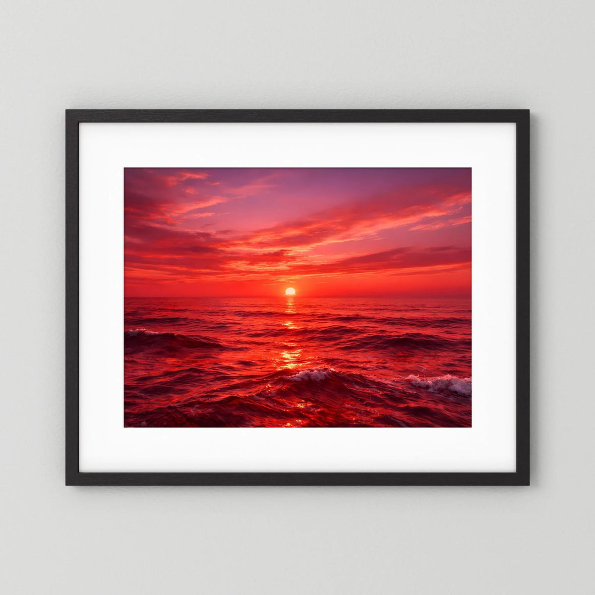 Poster mit Sonnenuntergang über dem Meer im schwarzen Rahmen und weißer Einfassung