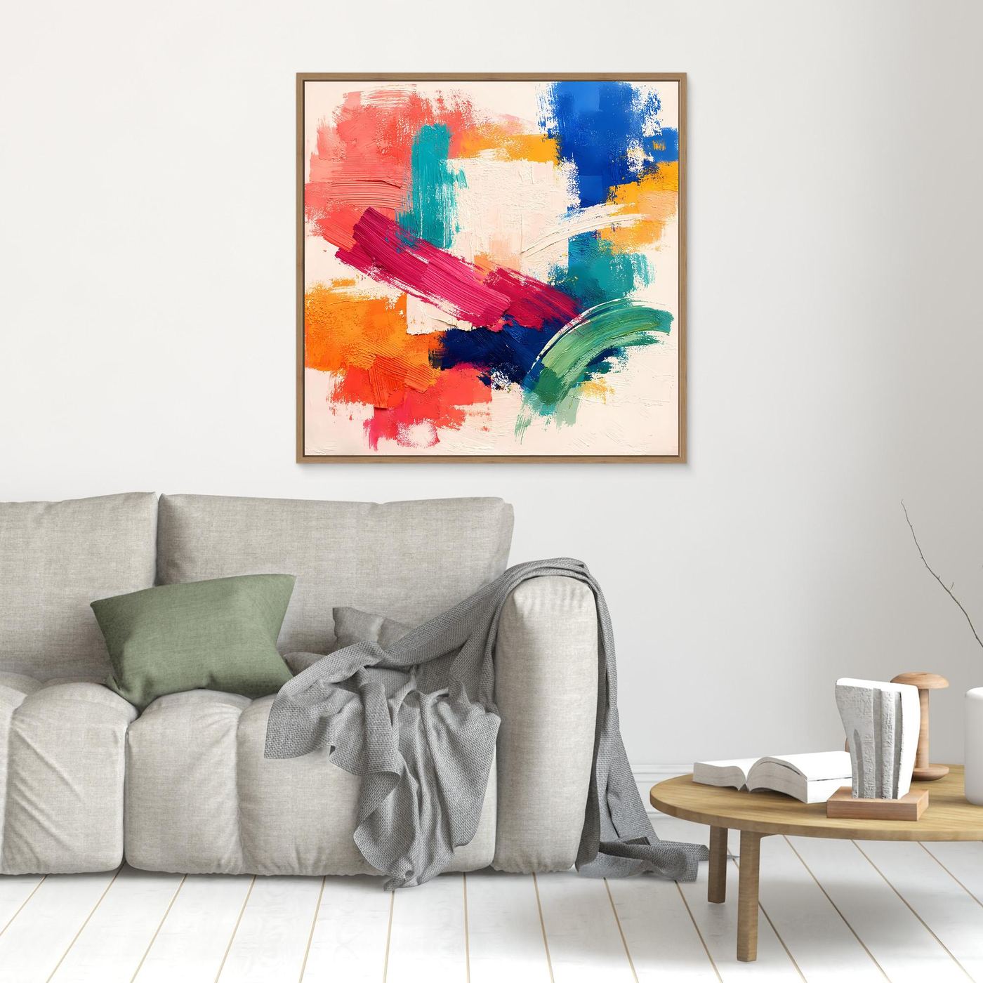 Abstract canvas wall art with gold-toned frame, multicolor brush strokes on light background