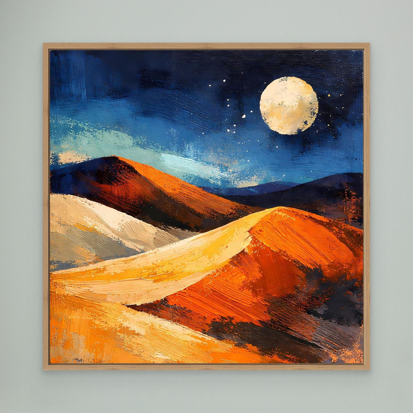Abstract desert wall art with moonlit dunes at night, in a light wood frame