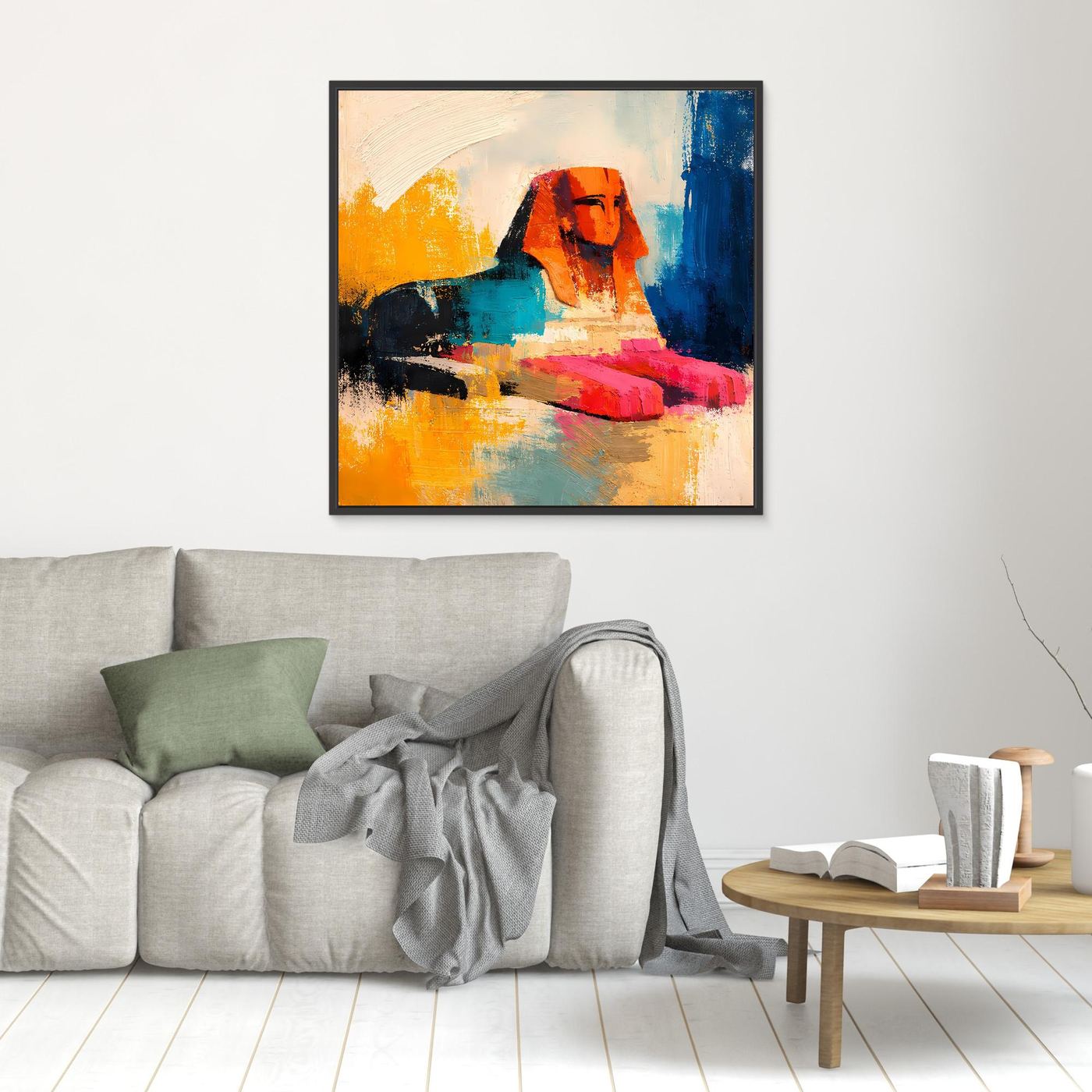Small abstract sphinx wall art with orange, teal, red, and blue strokes in a black frame