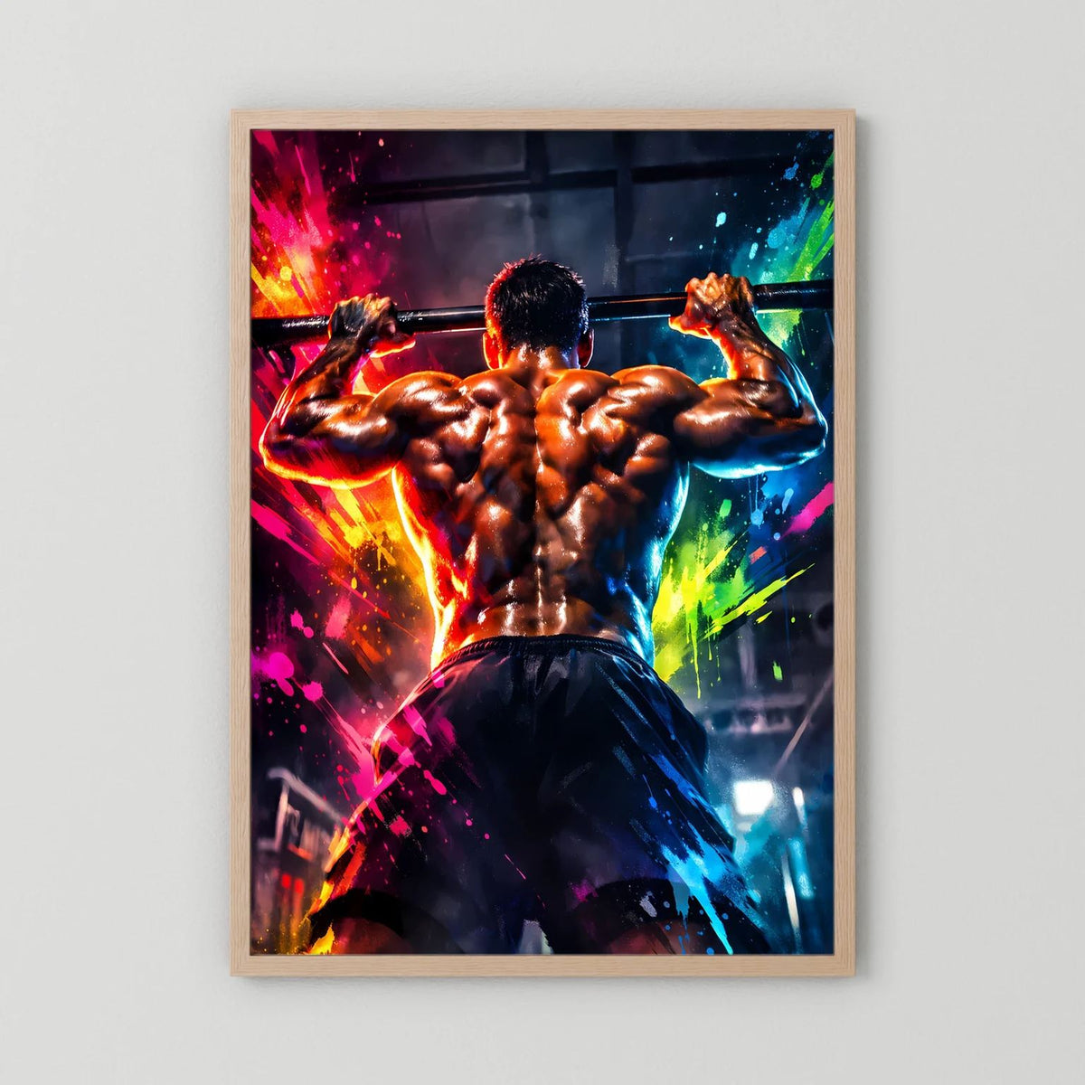 Fitness-Wandbild mit muskulösem Mann beim Klimmzug, farbige Spritzer, heller Holzrahmen