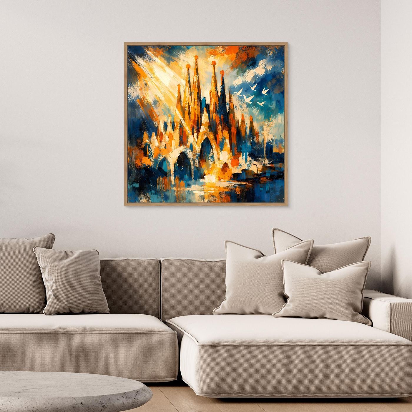 Abstraktes Leinwandbild mit hellem Holzrahmen, Architekturmotiv mit Türmen in Blau-Orange und Gelb.