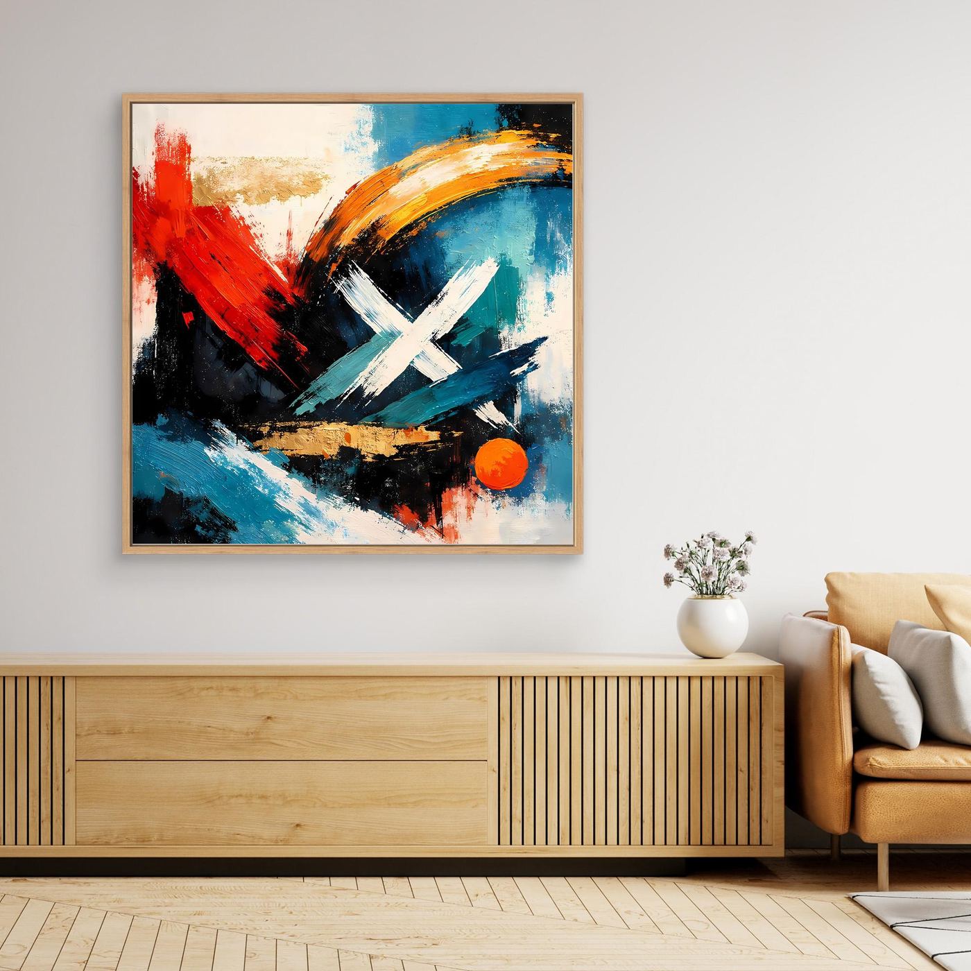 Leinwandbild im hellen Holzrahmen mit abstraktem Rot-Blau-Schwarz-Motiv und goldenem X