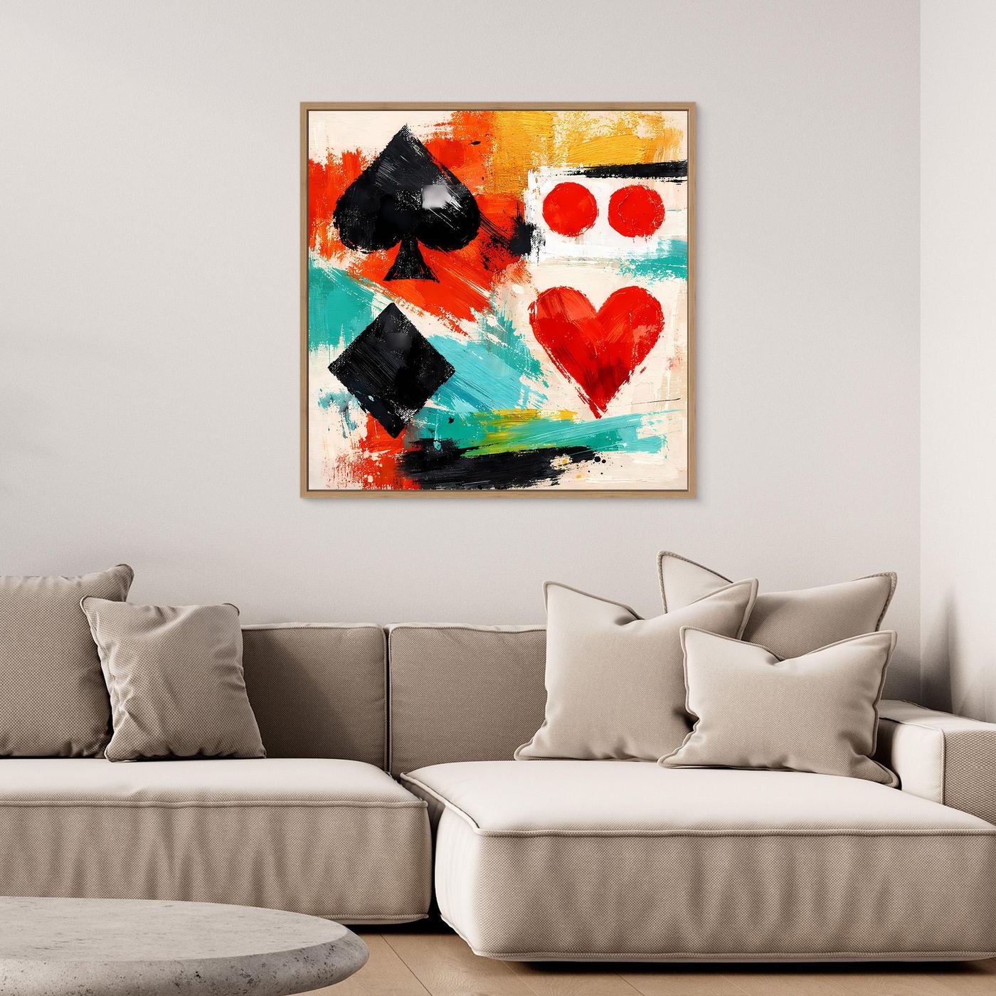 Abstract canvas wall art with spade and heart shapes, framed in light wood.