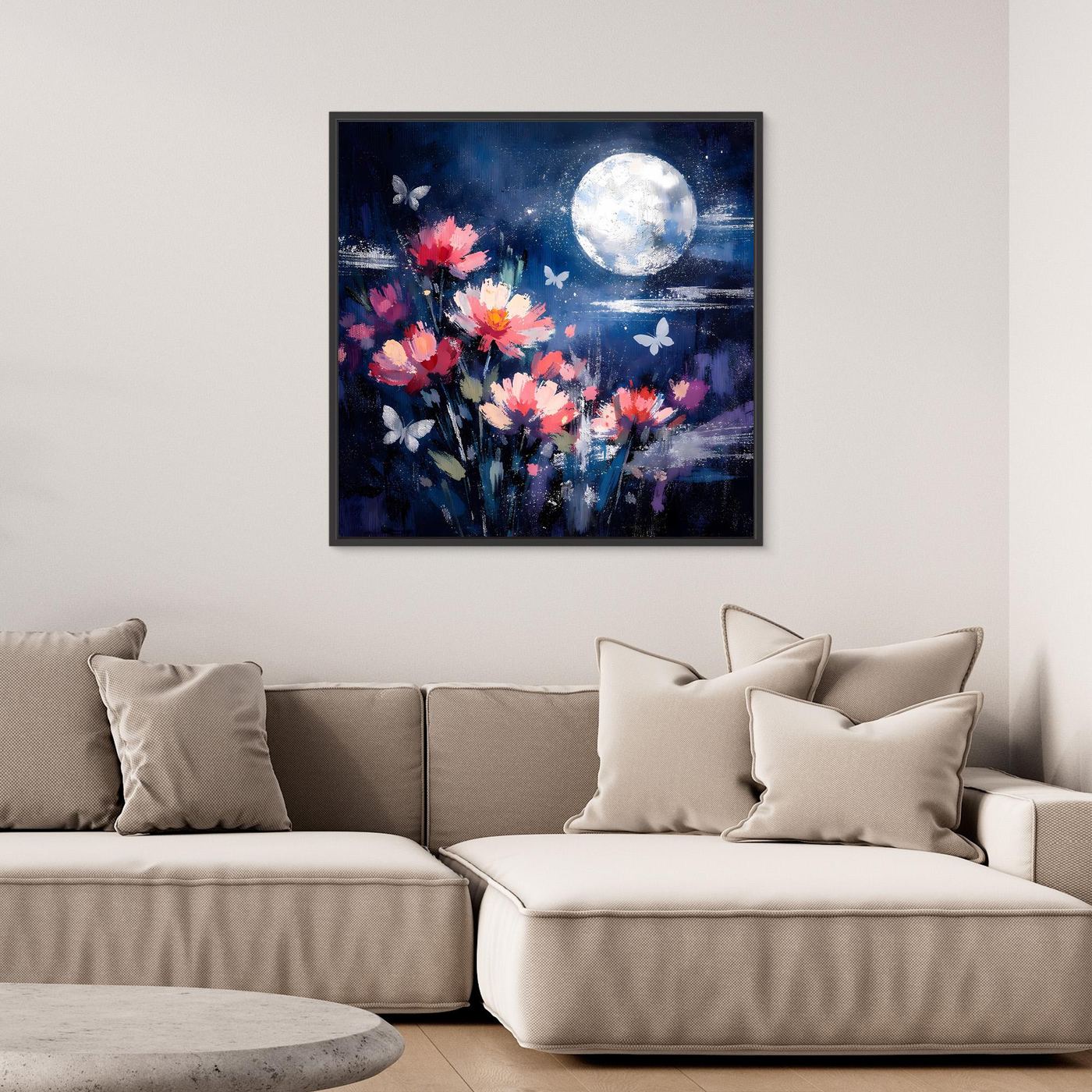 Gerahmtes Wandbild mit blauen Blumen, Schmetterlingen und Vollmond; schwarzer Rahmen.