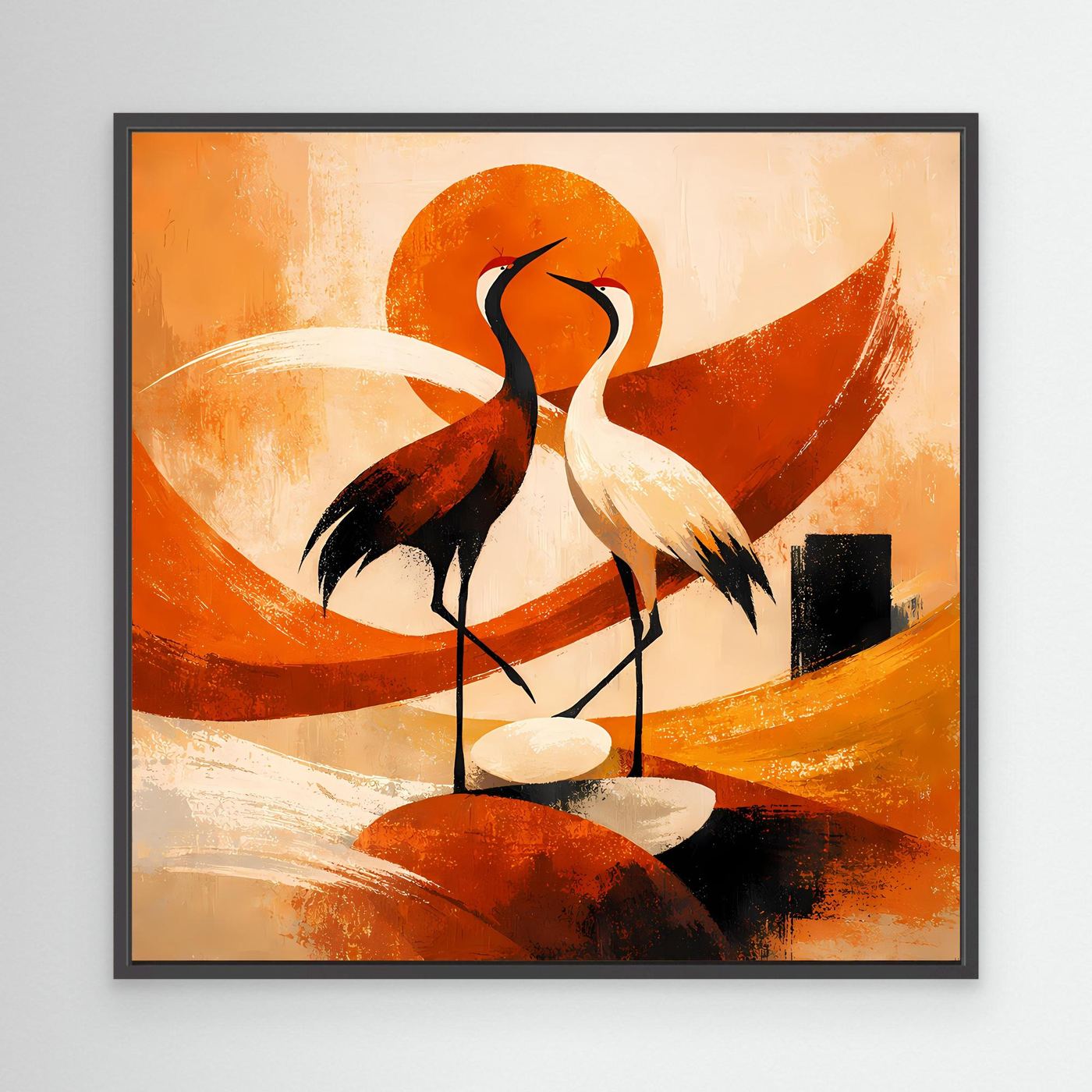 Schwarzes gerahmtes Leinwand-Wandbild mit zwei Kranichen, orangefarbener Sonne im Farbbogen.