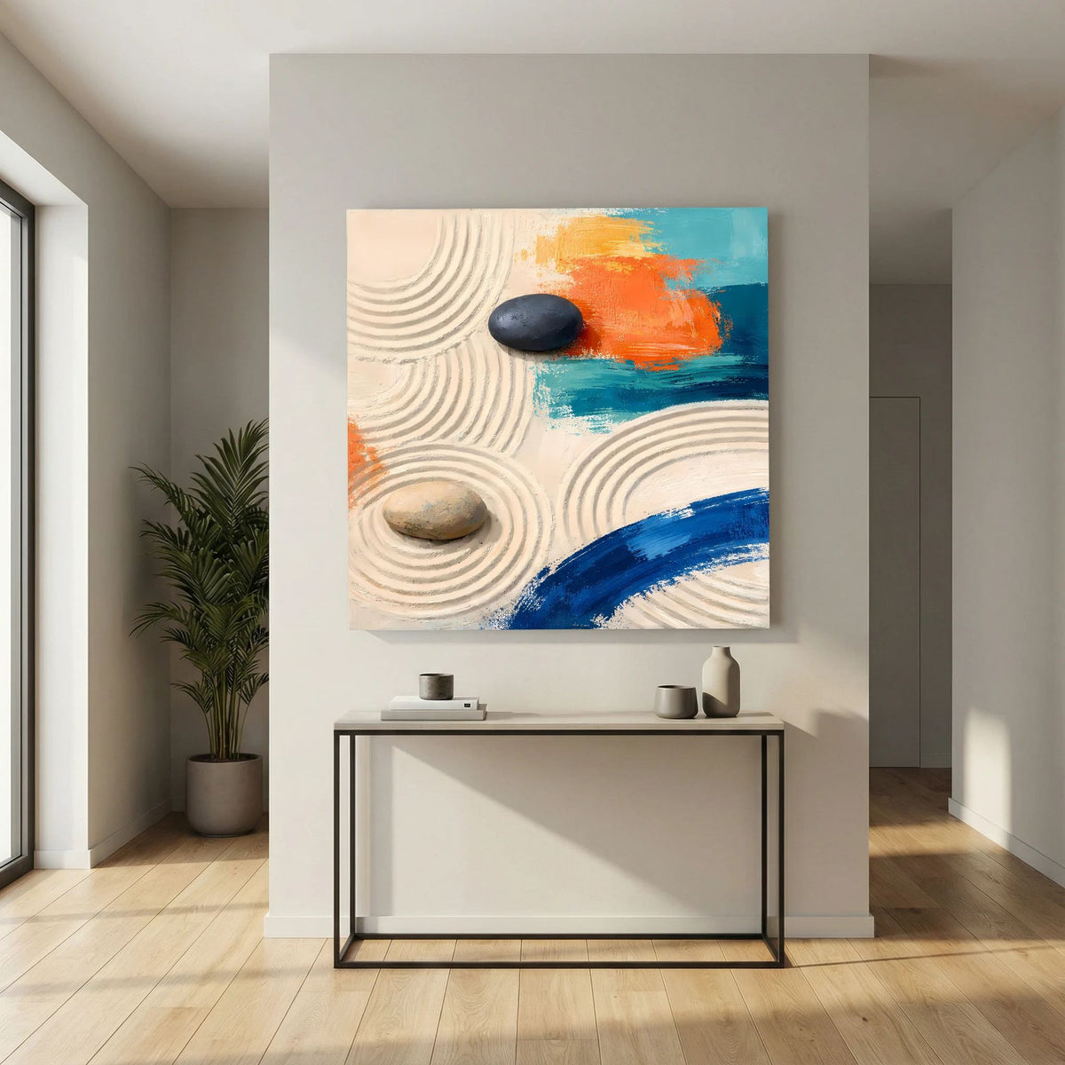 Zen-Leinwandbild mit runden Sandlinien, hellem Stein und blauem Farbauftrag